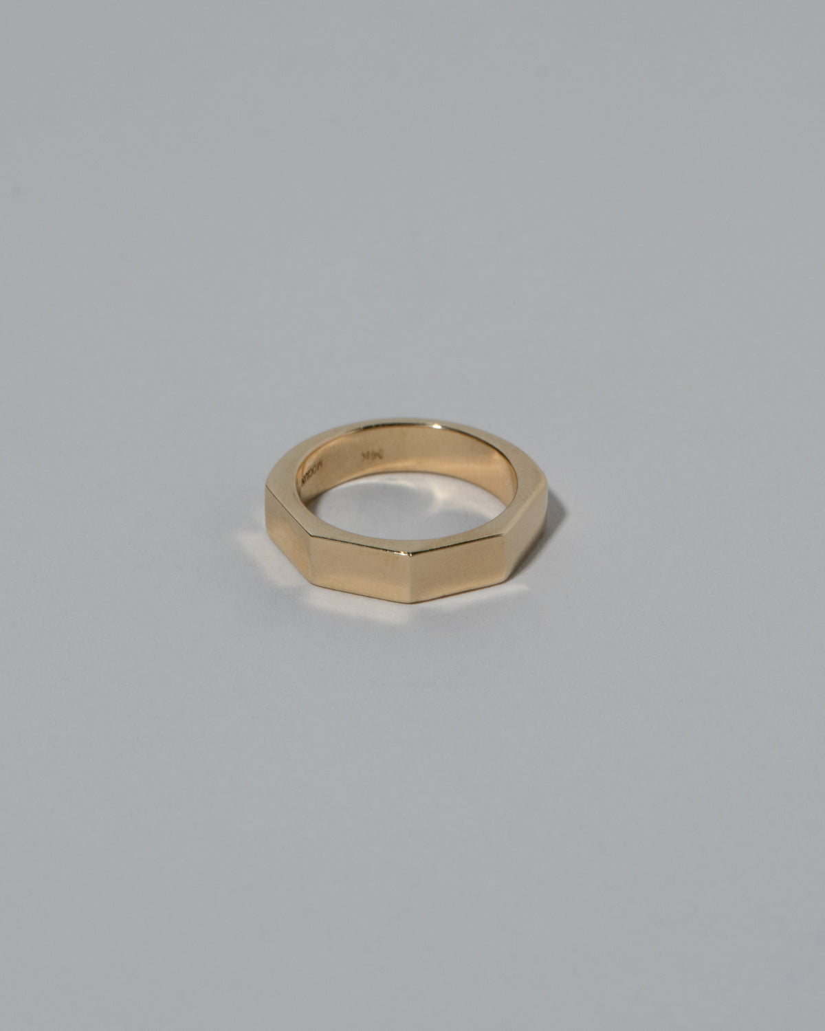 Gold 5mm Segmented Half Hoop Band on light color background.