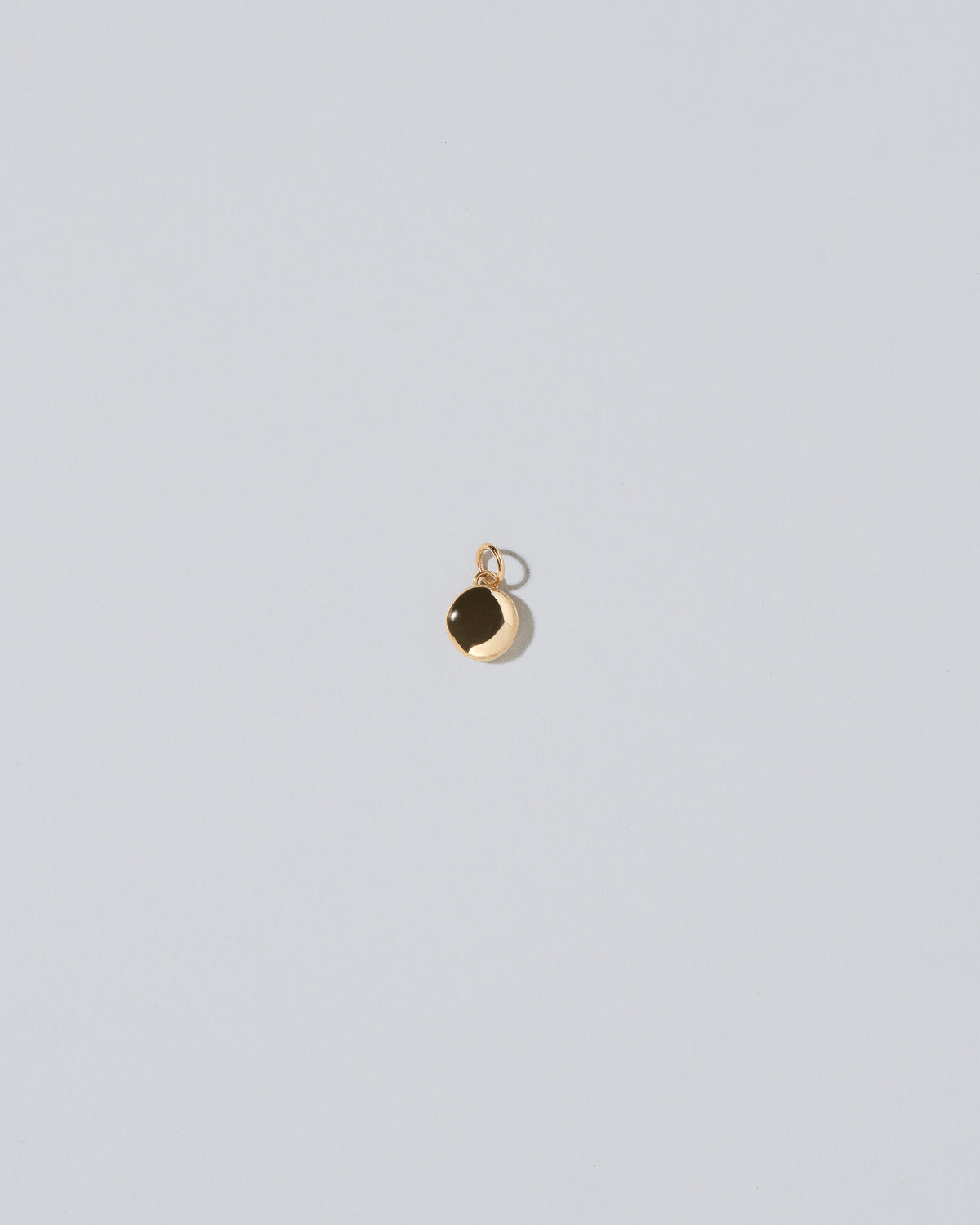 Mini Macaron Charm - 14k Gold on light color background.