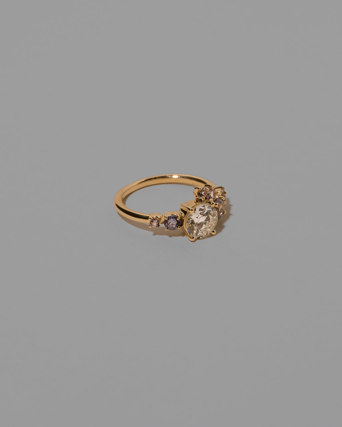 View from the side of the Lavender Luna Ring on light color background.