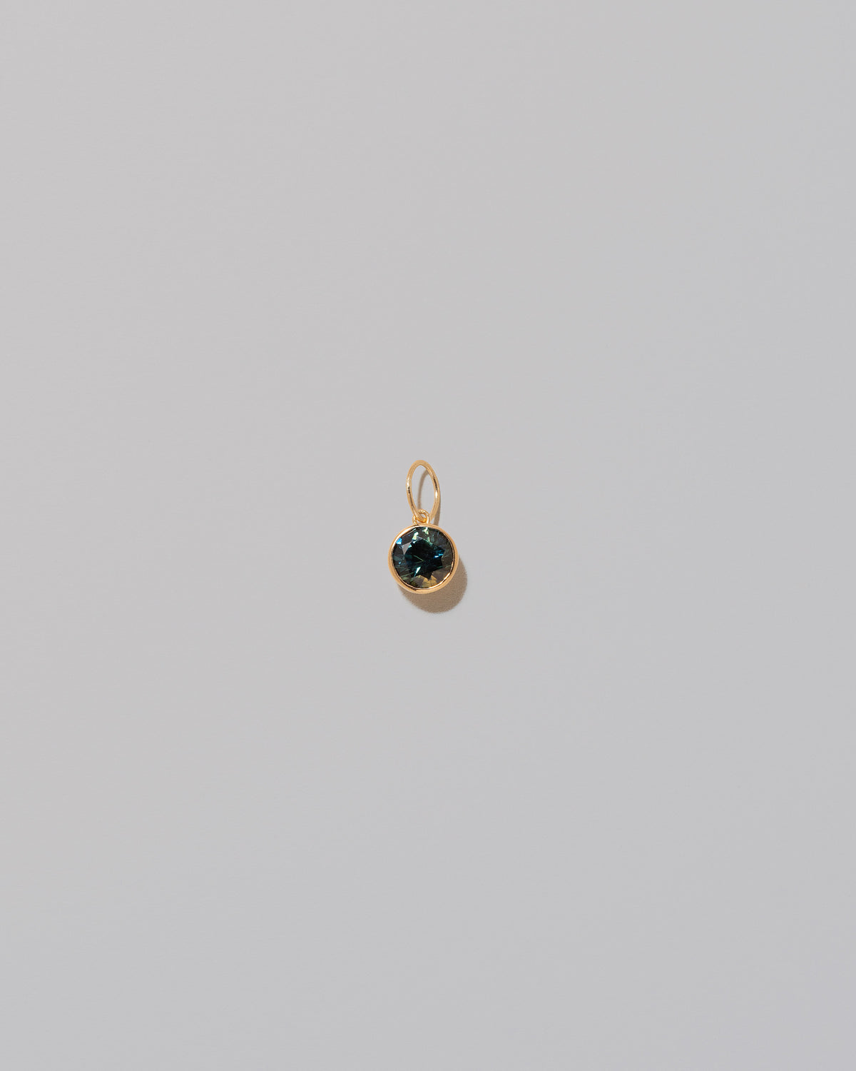 Bicolor Sapphire Pendant on light color background.
