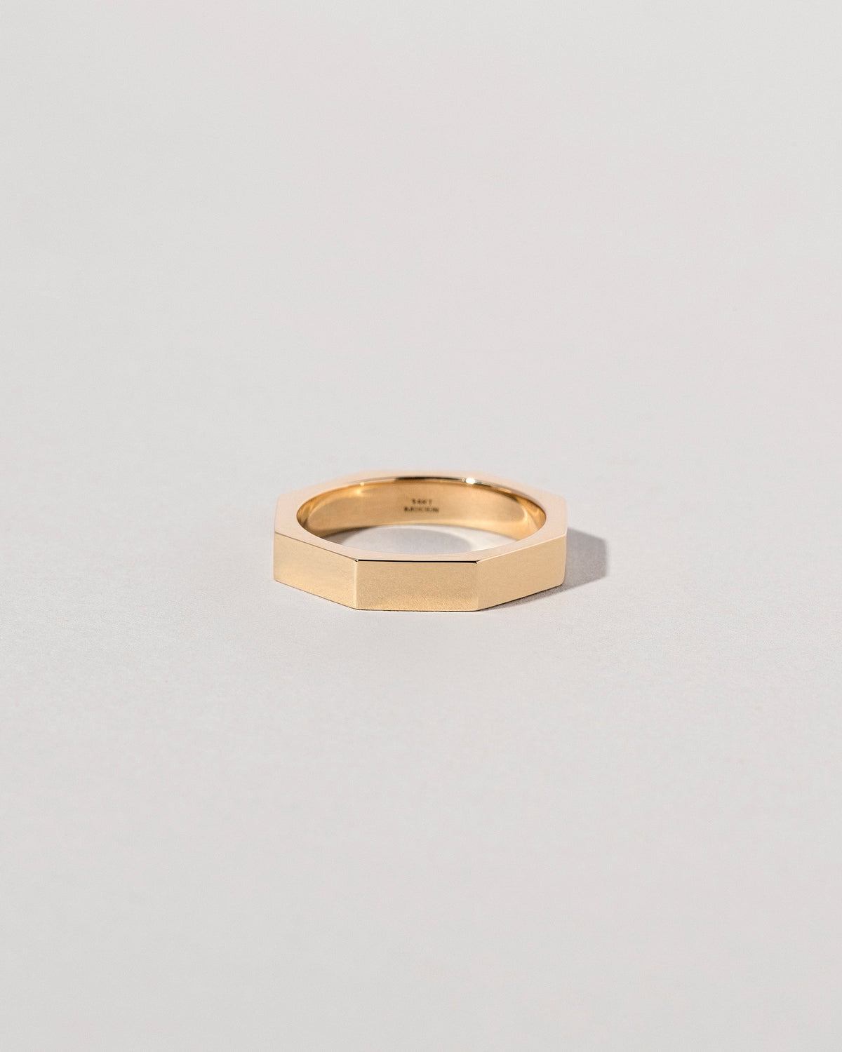 Gold 4mm Segmented Band on light color background.
