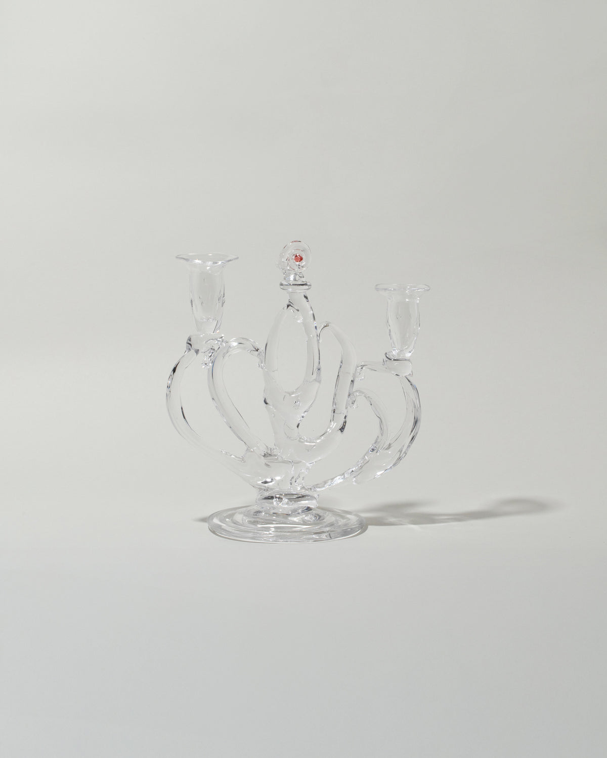 Silje Lindrup Four Glass Candelabra on light color background.