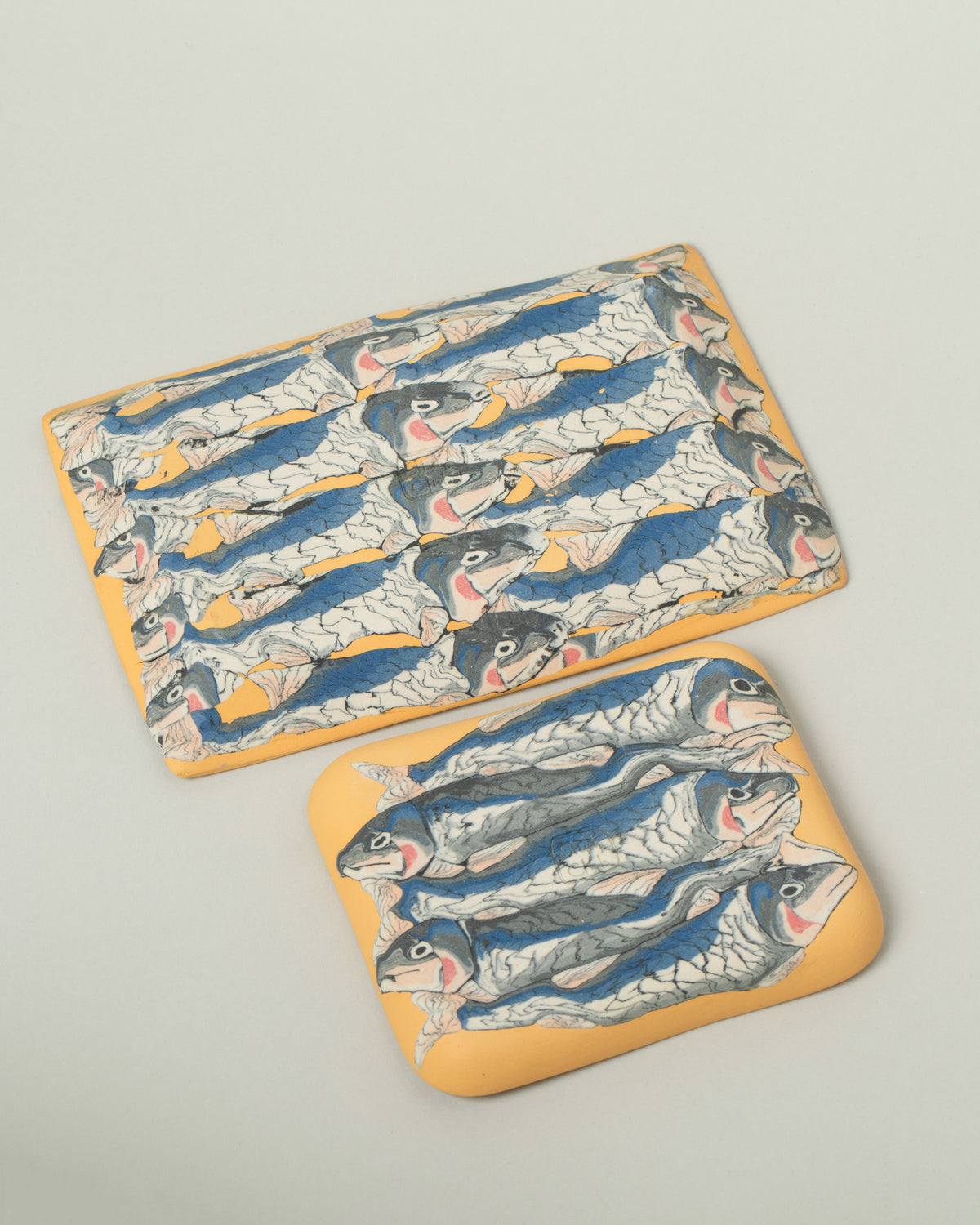 View from the back of the Slush Club Large and Small Nerikomi Sardine Trays on light color background.