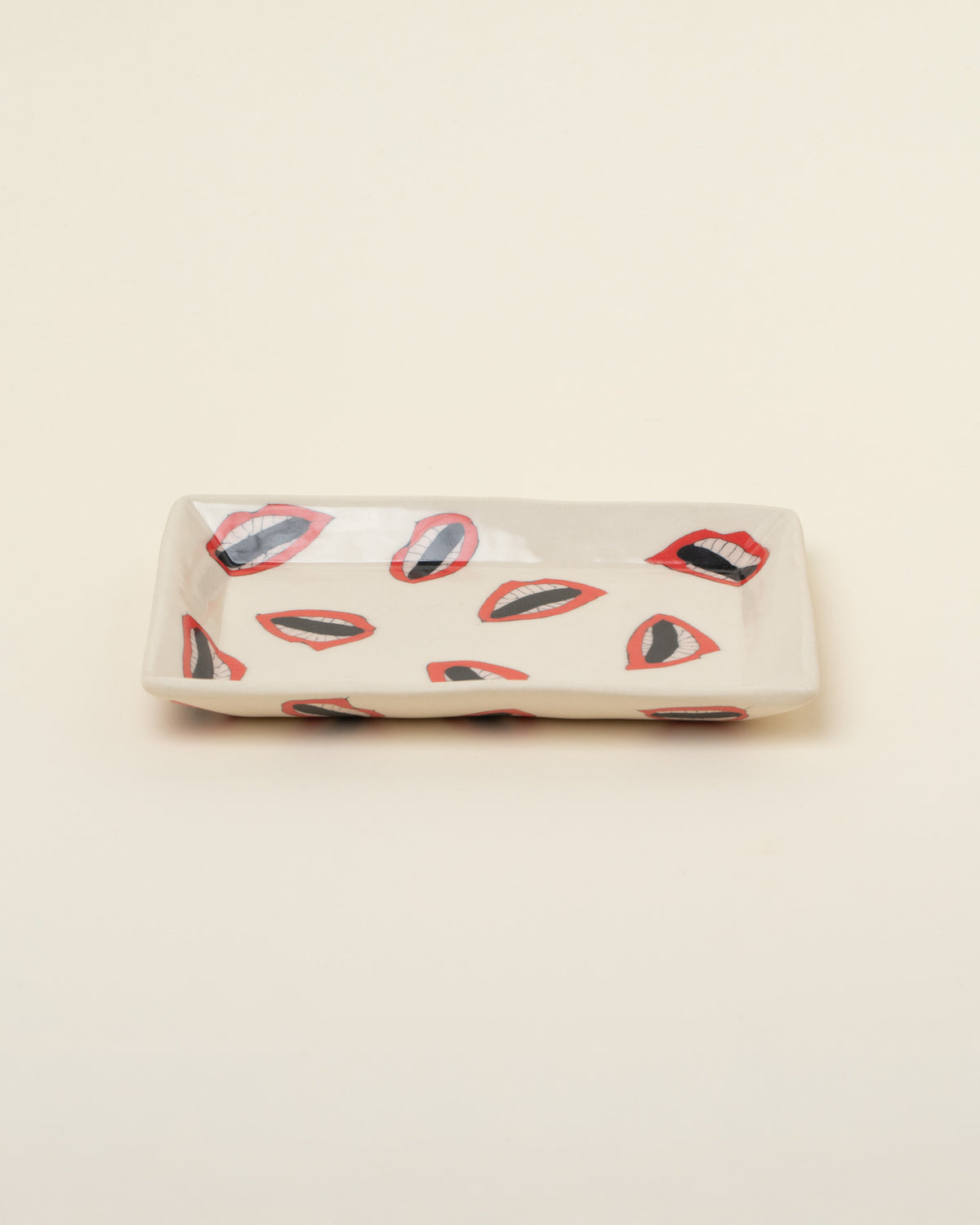 View from the side of the Slush Club Nerikomi Lip Tray on light color background.