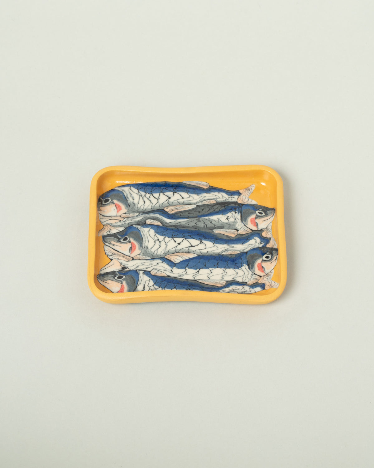 Slush Club Small Nerikomi Sardine Tray on light color background.