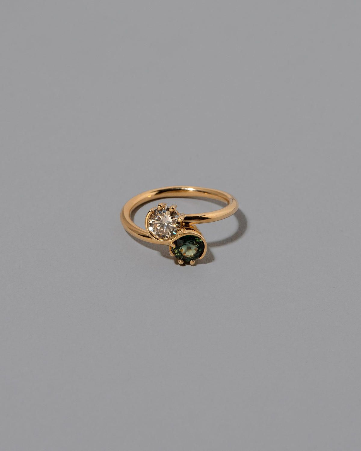 Sapphire & Champagne Diamond Sun & Moon Union Ring on light color background.