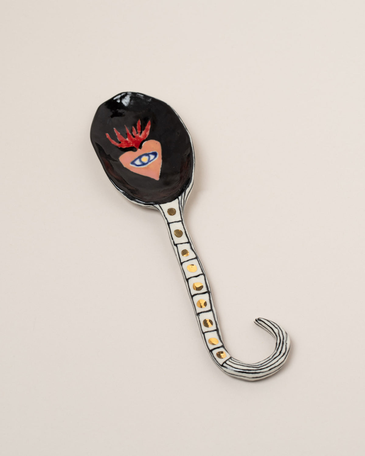 Suzanne Sullivan One I Can Promise 7.5" Spoon on light color background.