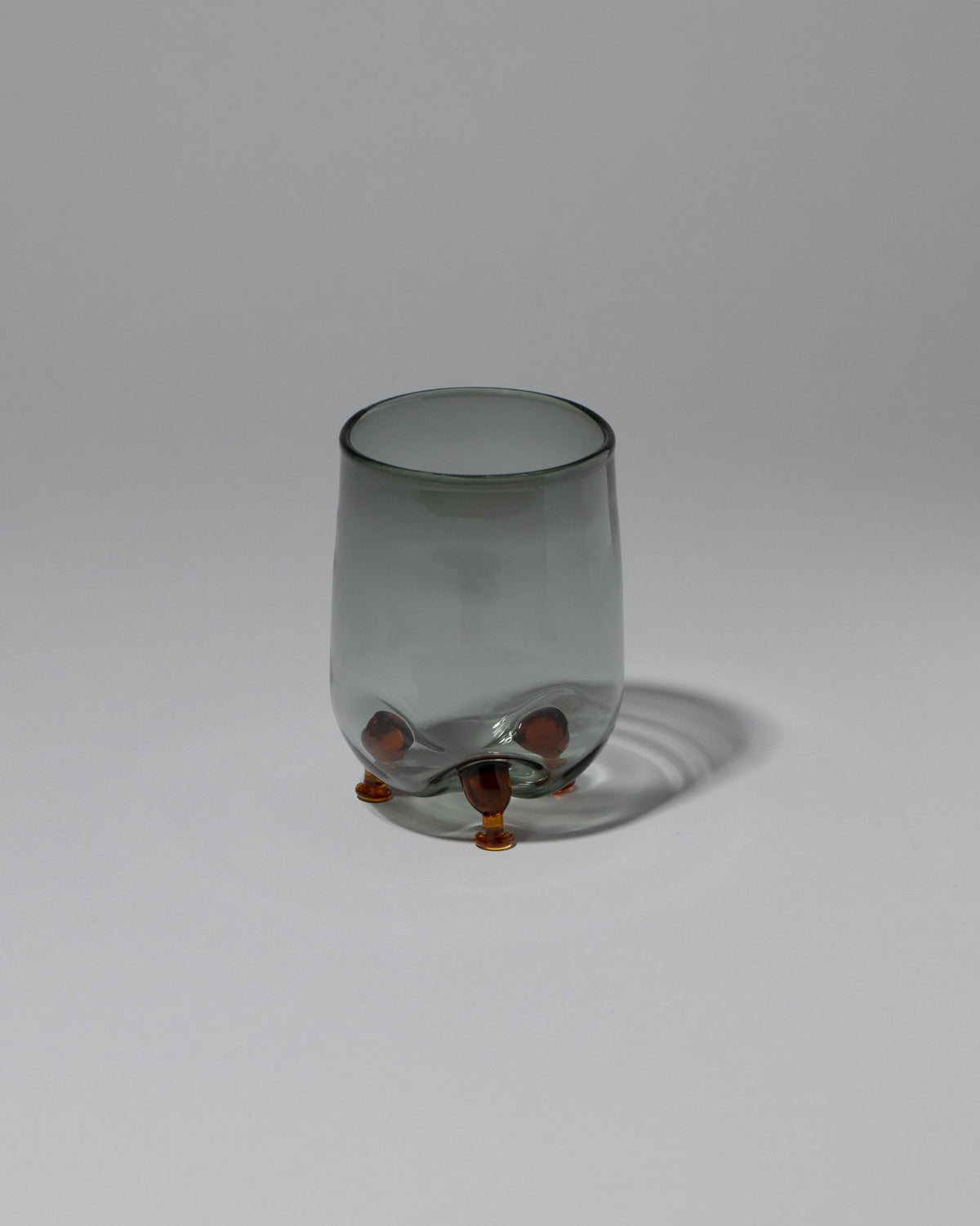 Ornamental by Lameice Gray & Amber Transparent Eye Candy Cocktail Glass on light color background.