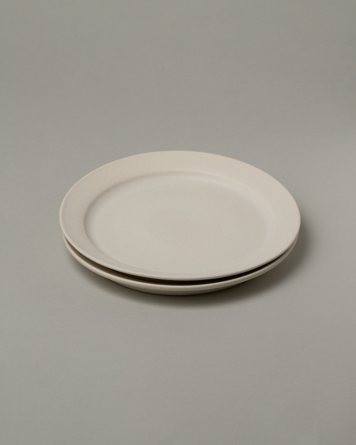 Tracie Hervy Salad Plates Set on light color background.