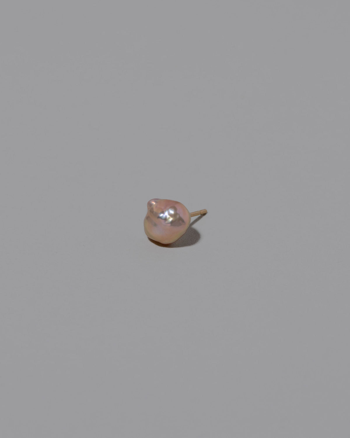 Blush Lagniappe Pearl Stud Earring Single on light color background.