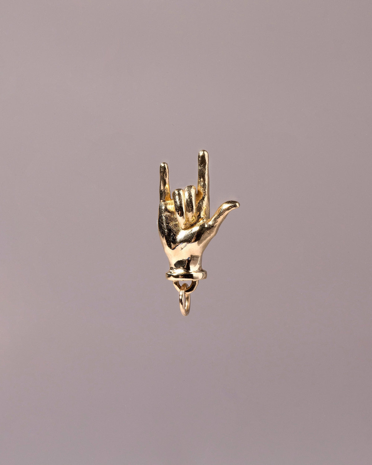 I Love You Sign Language Charm on light color background.