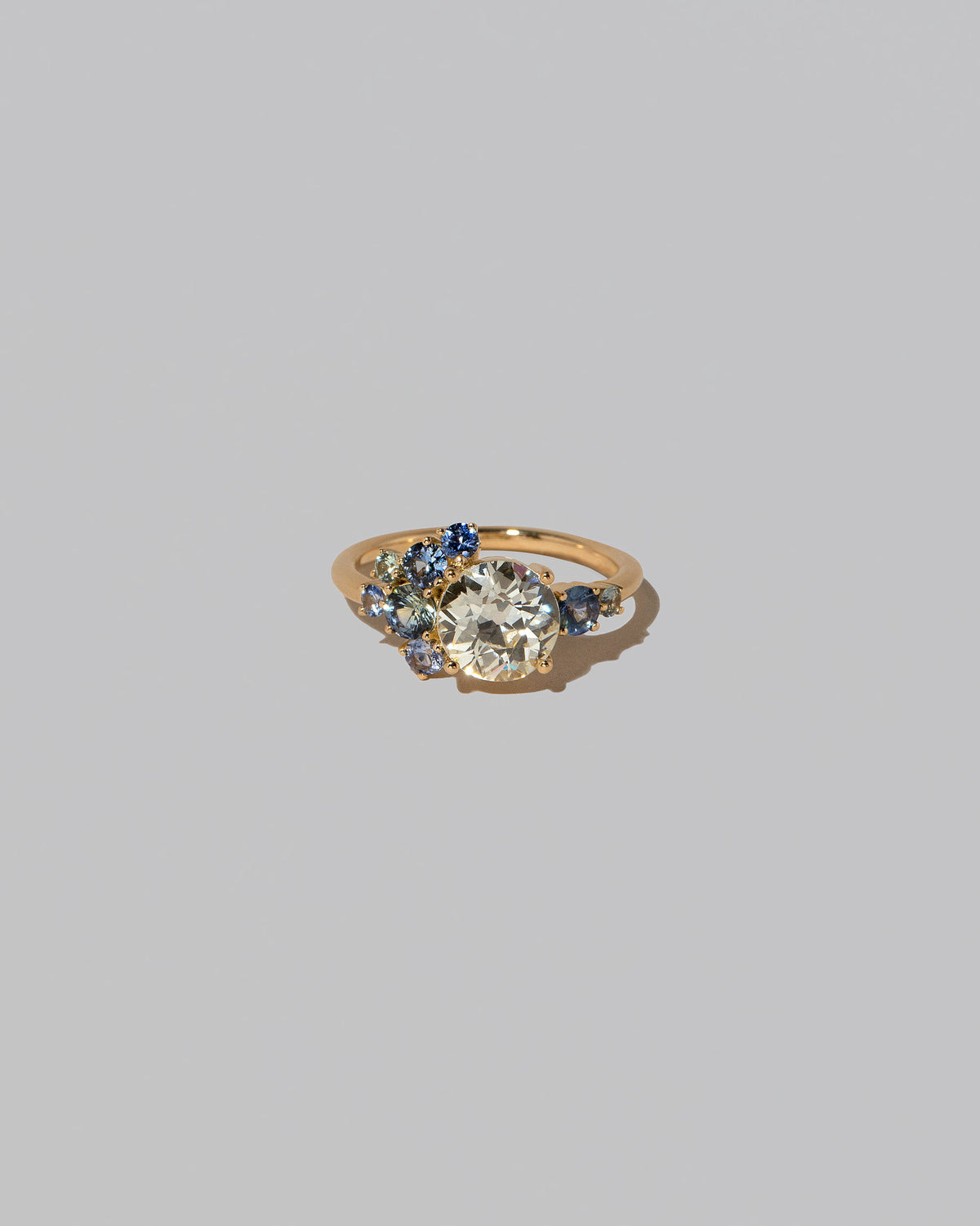 Diamond & Sapphire Vega Ring on light color background.