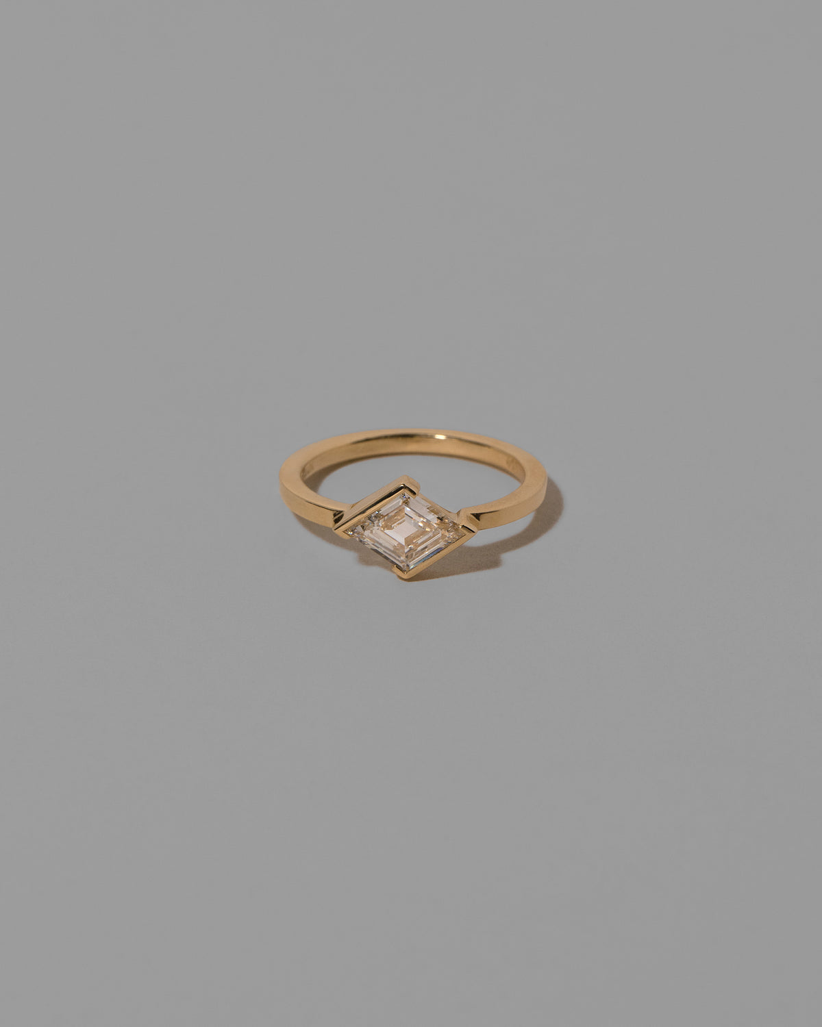 Benevolence Ring on light color background.