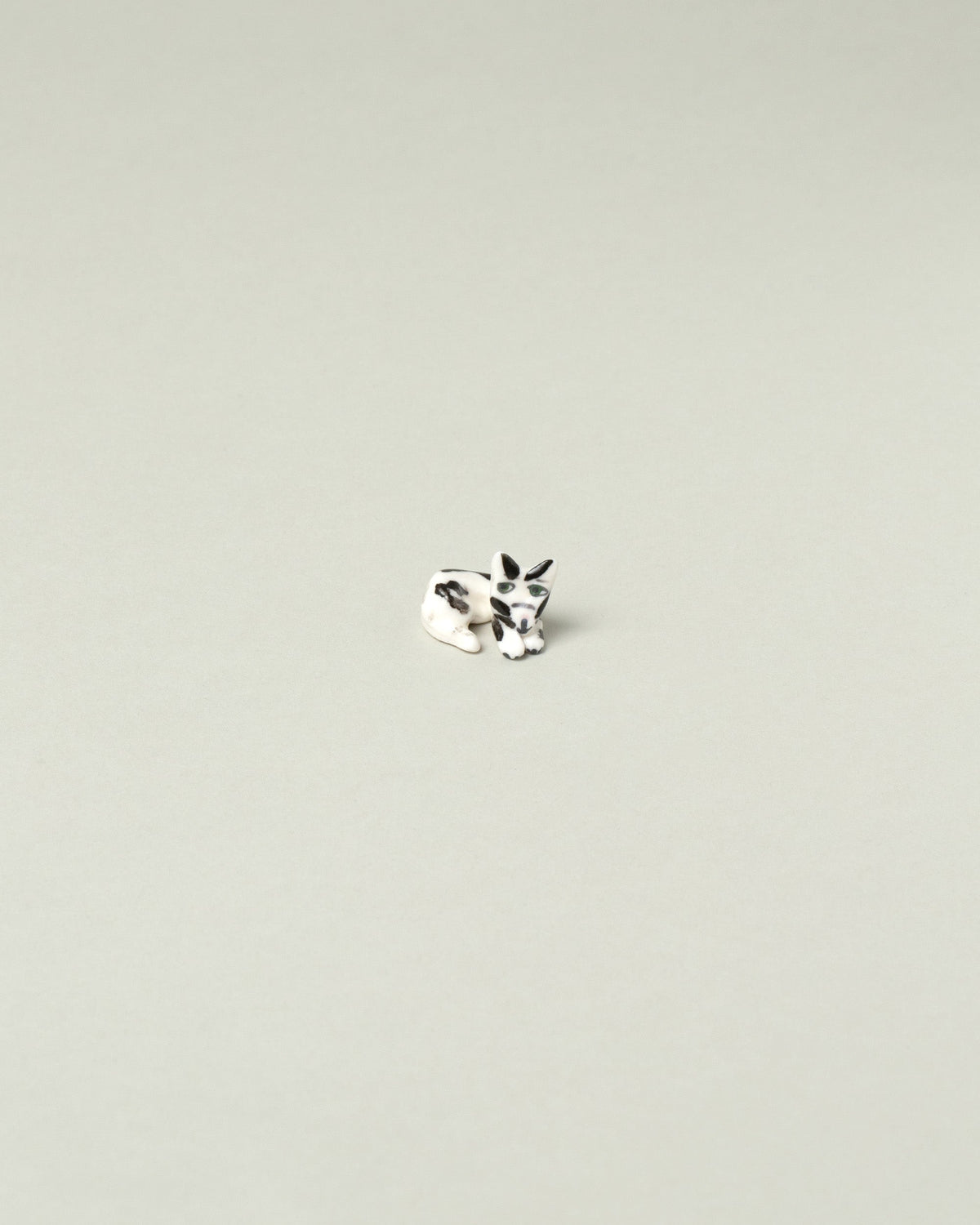 Eleonor Boström Black Spots Chopstick Cat Rest on light color background.