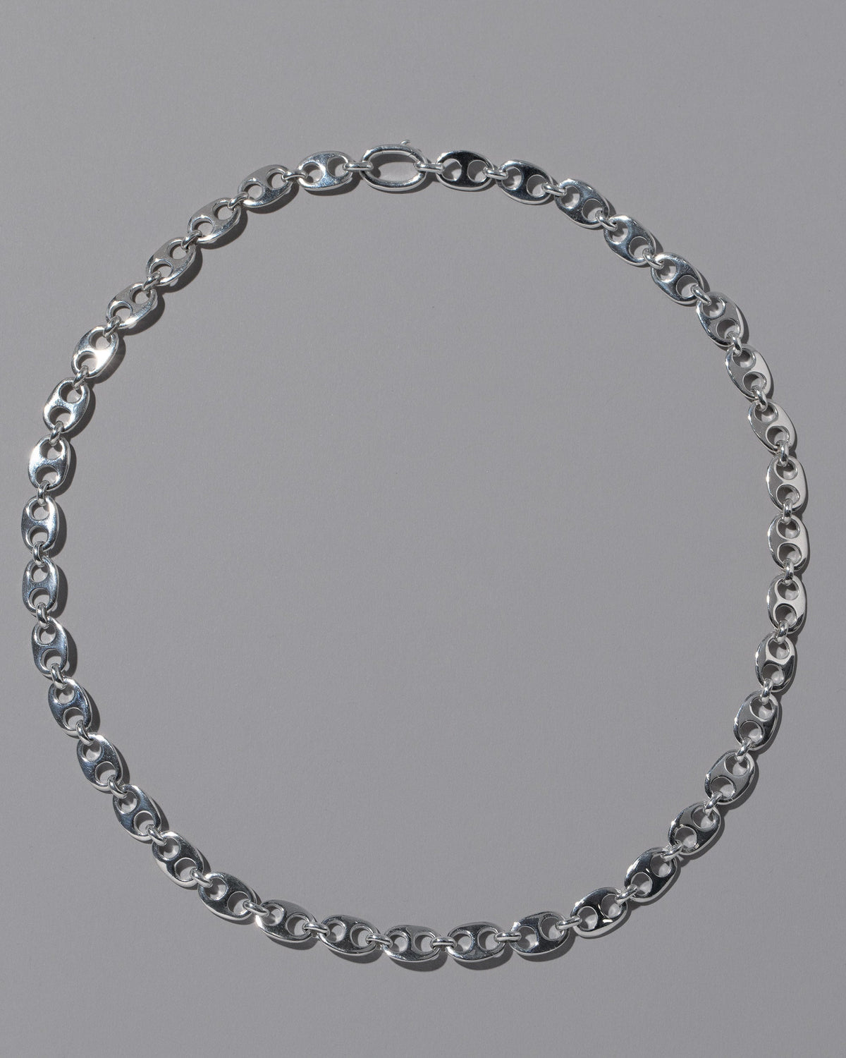 CRZM Sterling Silver Yuba Mini Necklace on light color background.