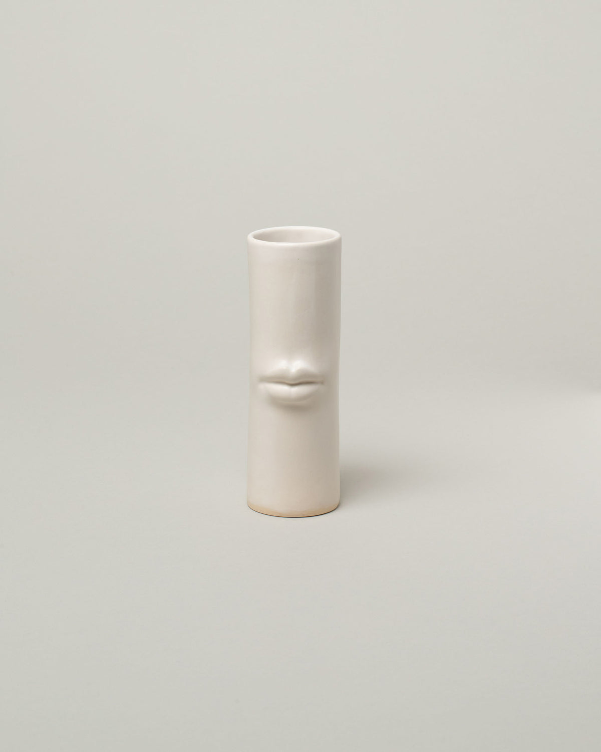 Bonam Kim White Lip Pillar Vase on light color background.