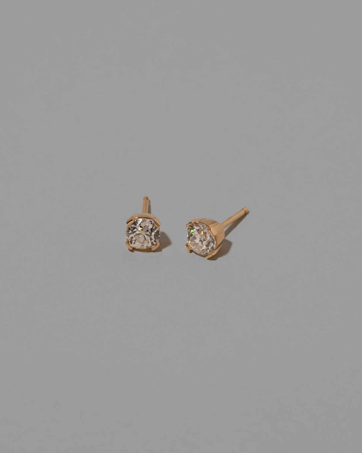 Inner Peace Earrings on light color background.