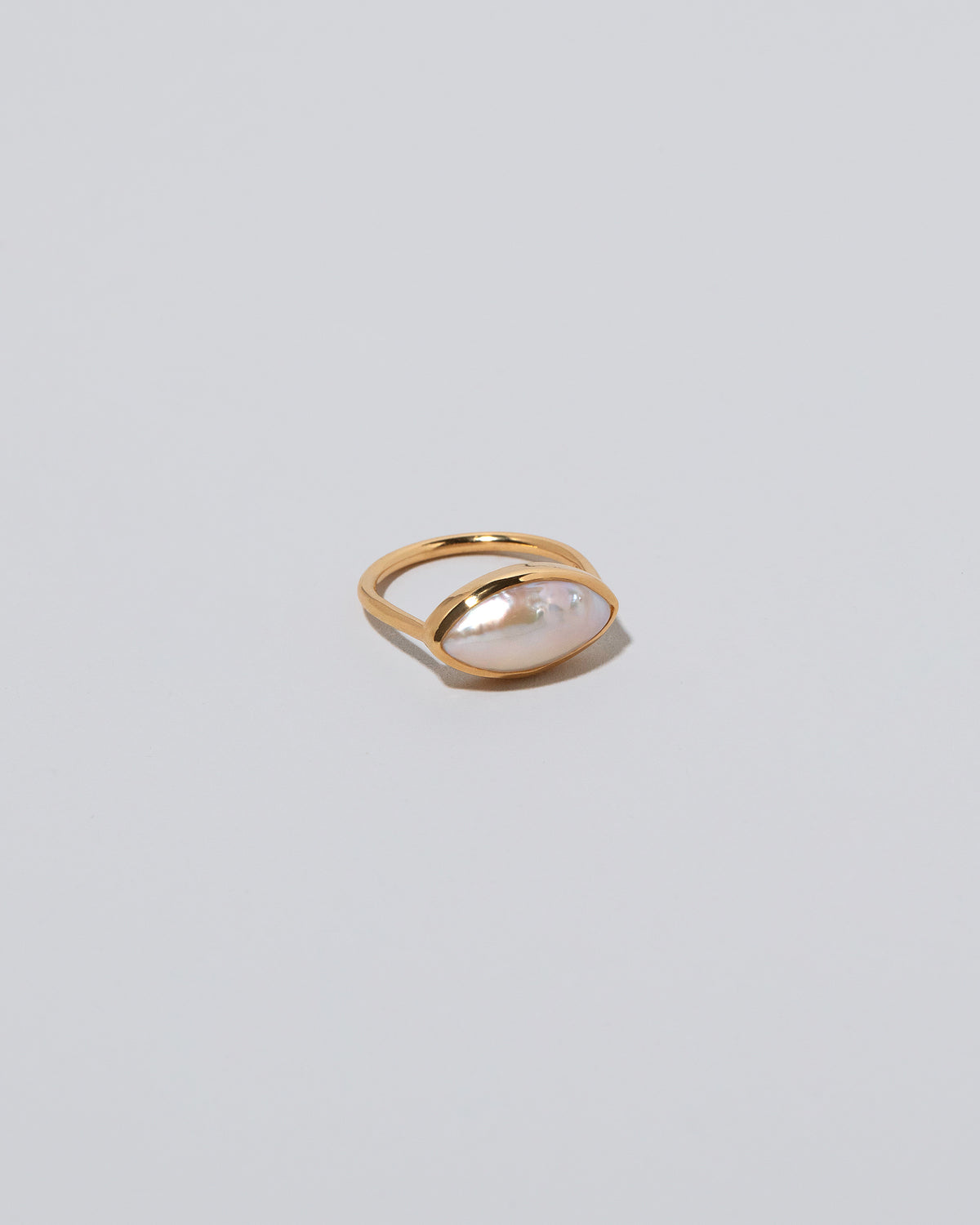18k Gold Jacana Pearl Ring on light color background.