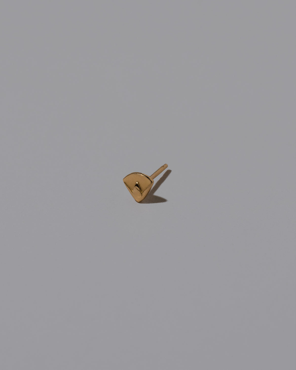 Lotus Blossom Stud Earring Single on light color background.