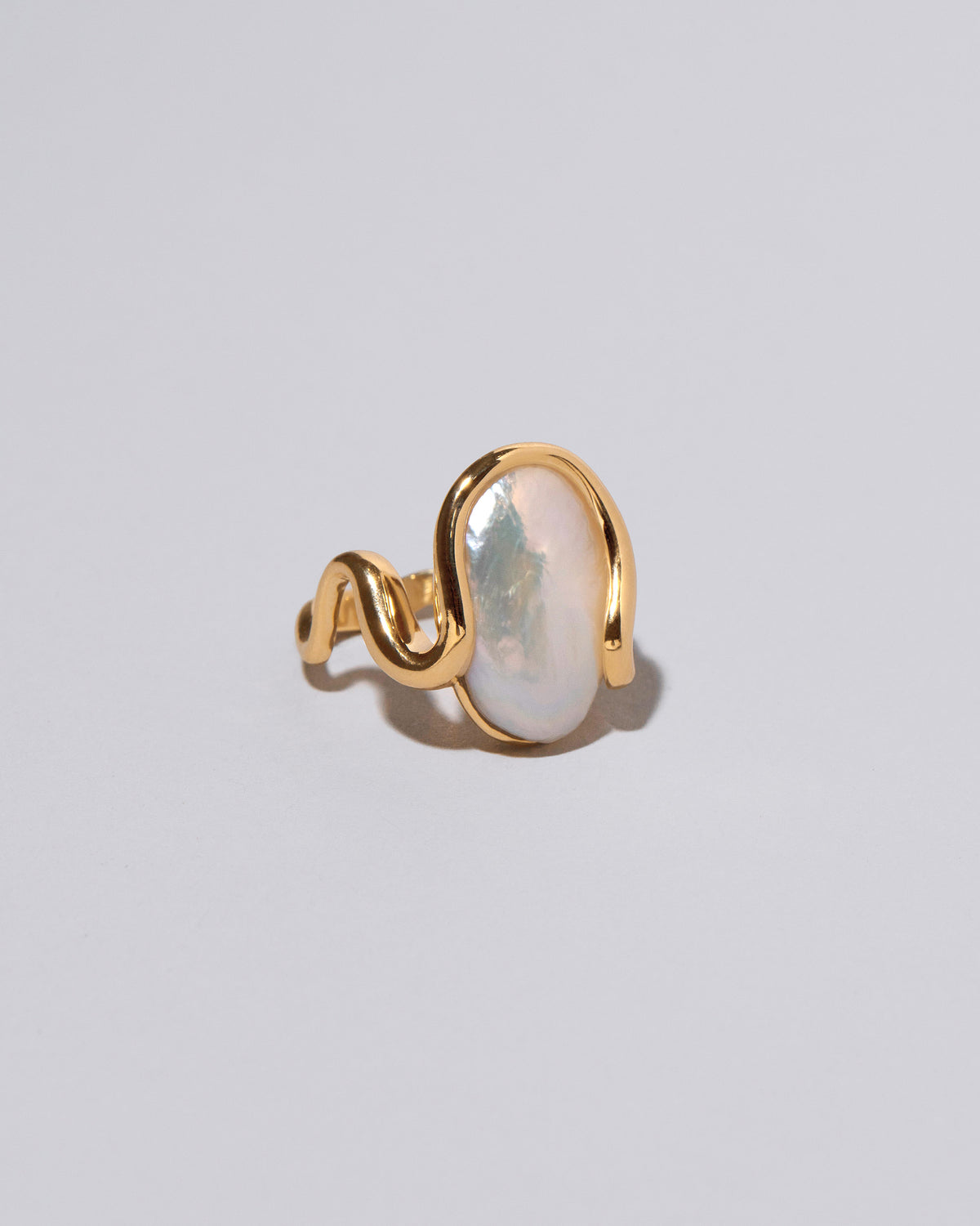 View from the side of the Weaver Ring on light color background.