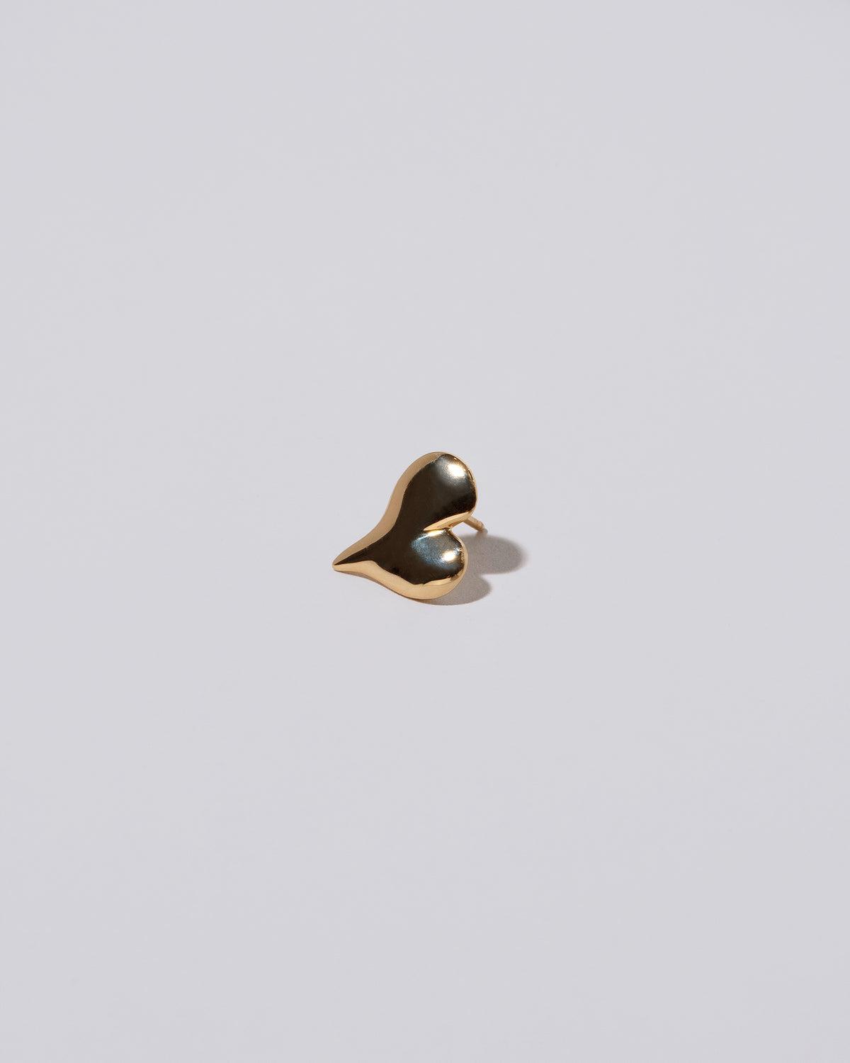 Thousand & One Night Heart Stud Earrings on light color background.