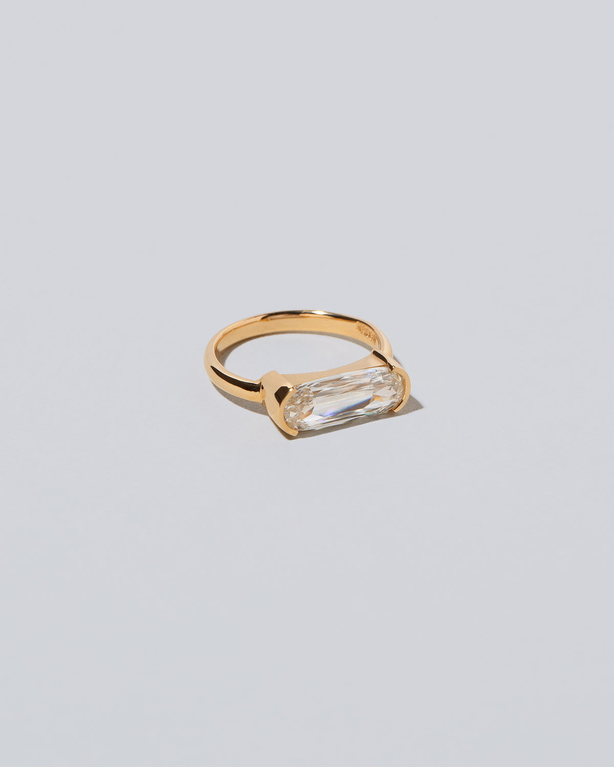 View from the side of the Elara Ring on light color background.