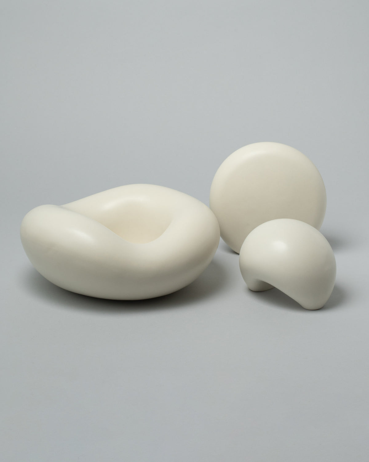 Group photo of Dust and Form Unda Form, Listening Form, and Being Form on light colored background.