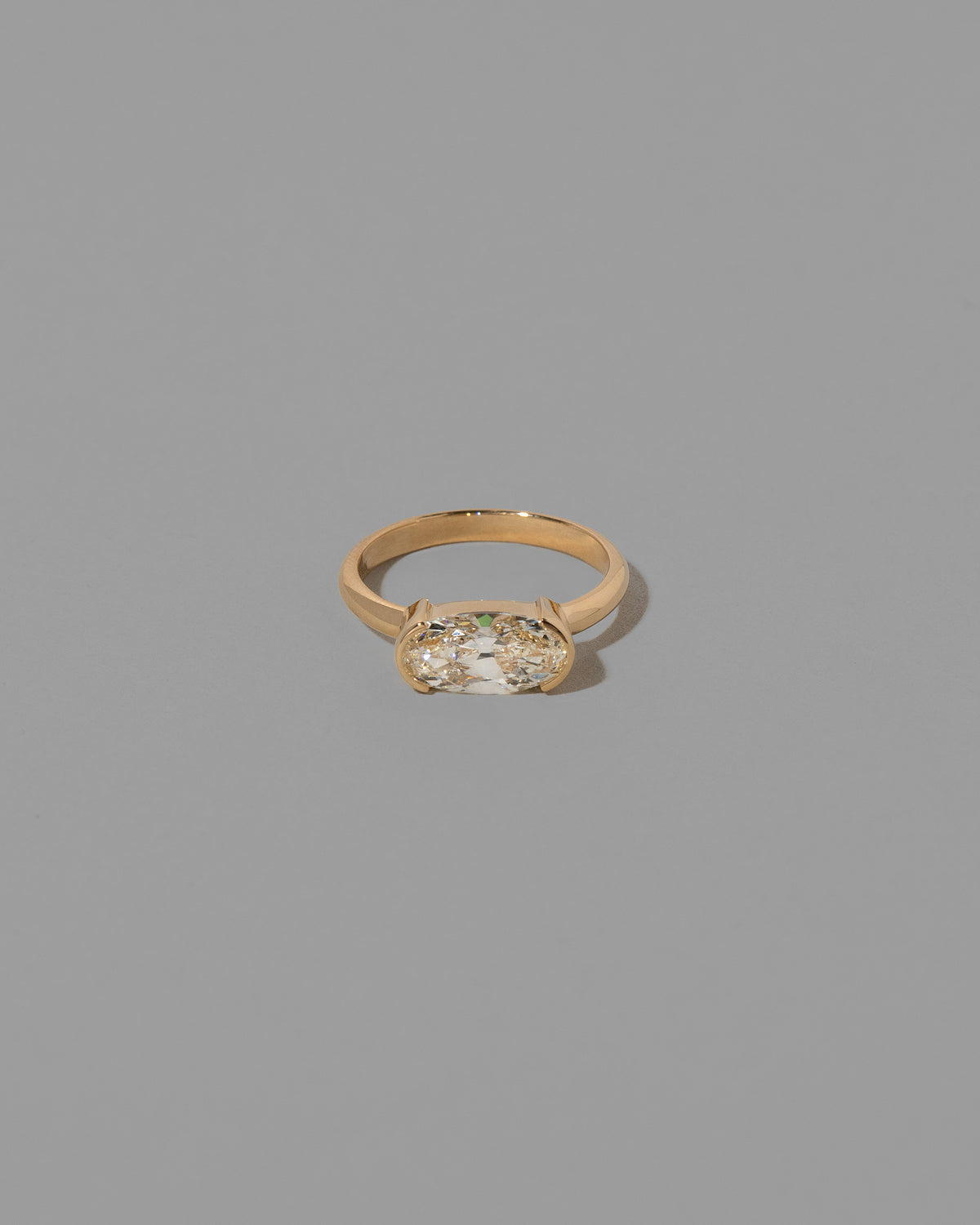 White Diamond Oval Diamond Transformation Ring on light color background.