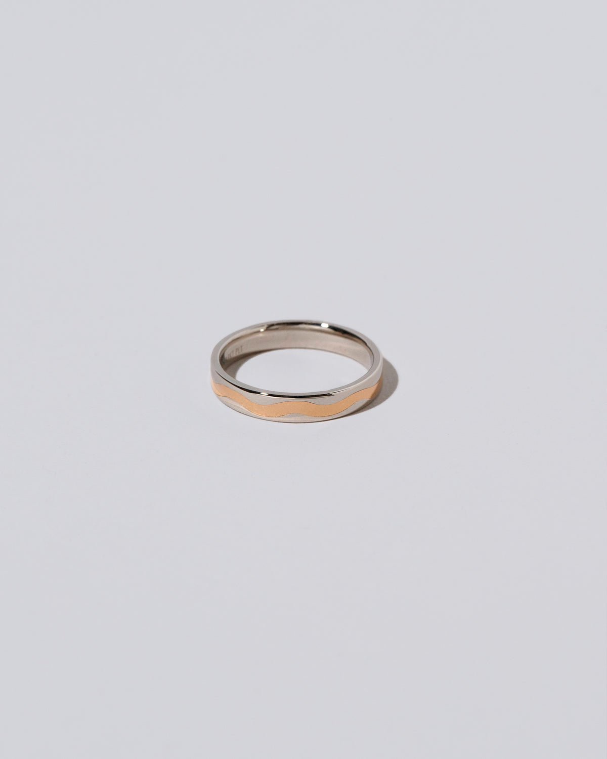 3mm Platinum Outside, Yellow 18K Inside Swimming Pool Band on light color background.