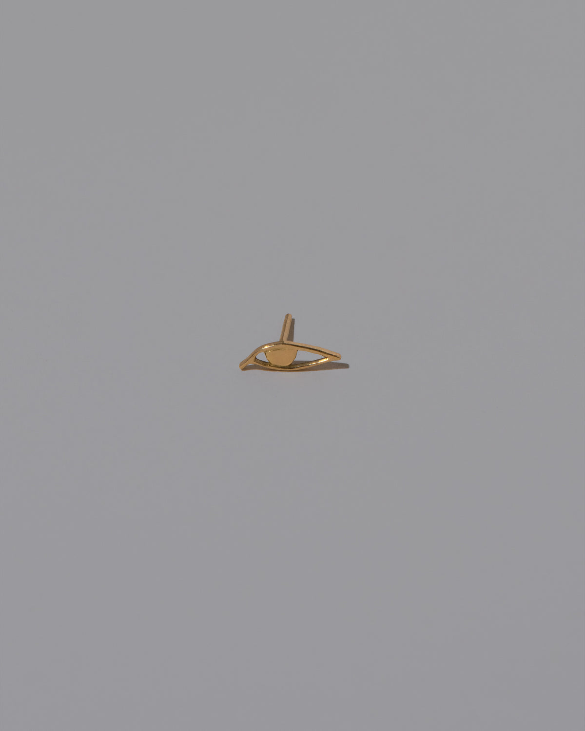 Left Eye Stud Earring Single on light color background.