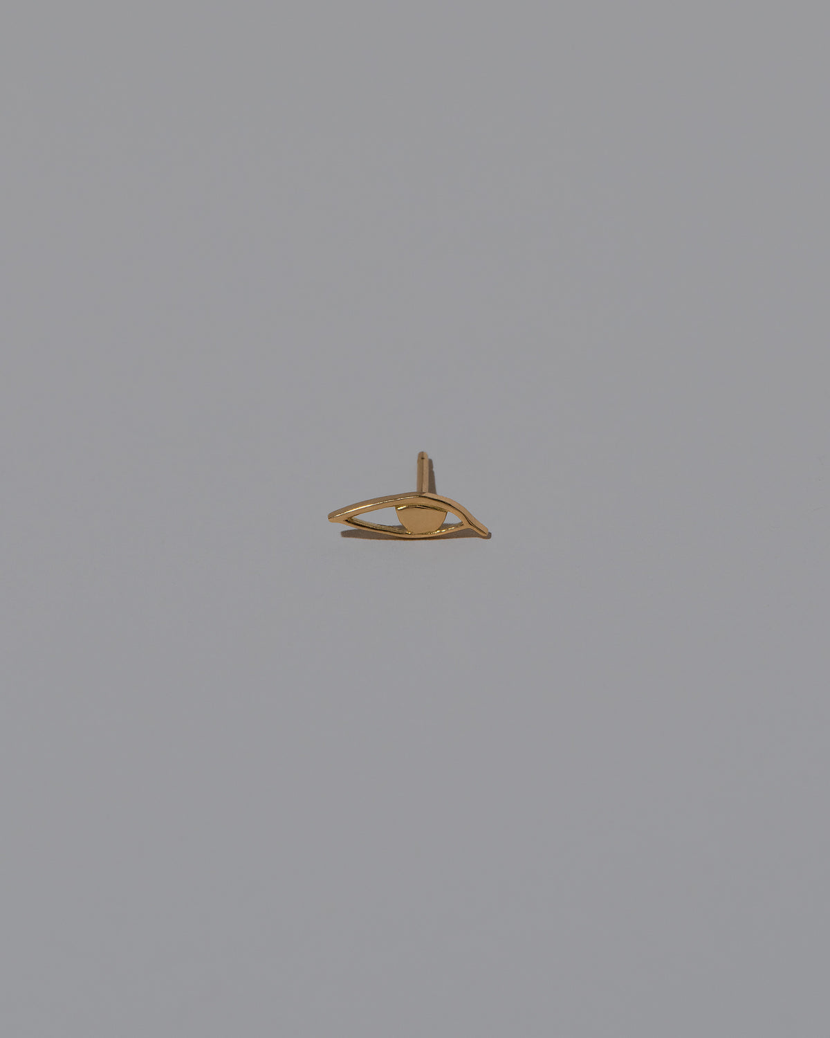 Right Eye Stud Earring Single on light color background.