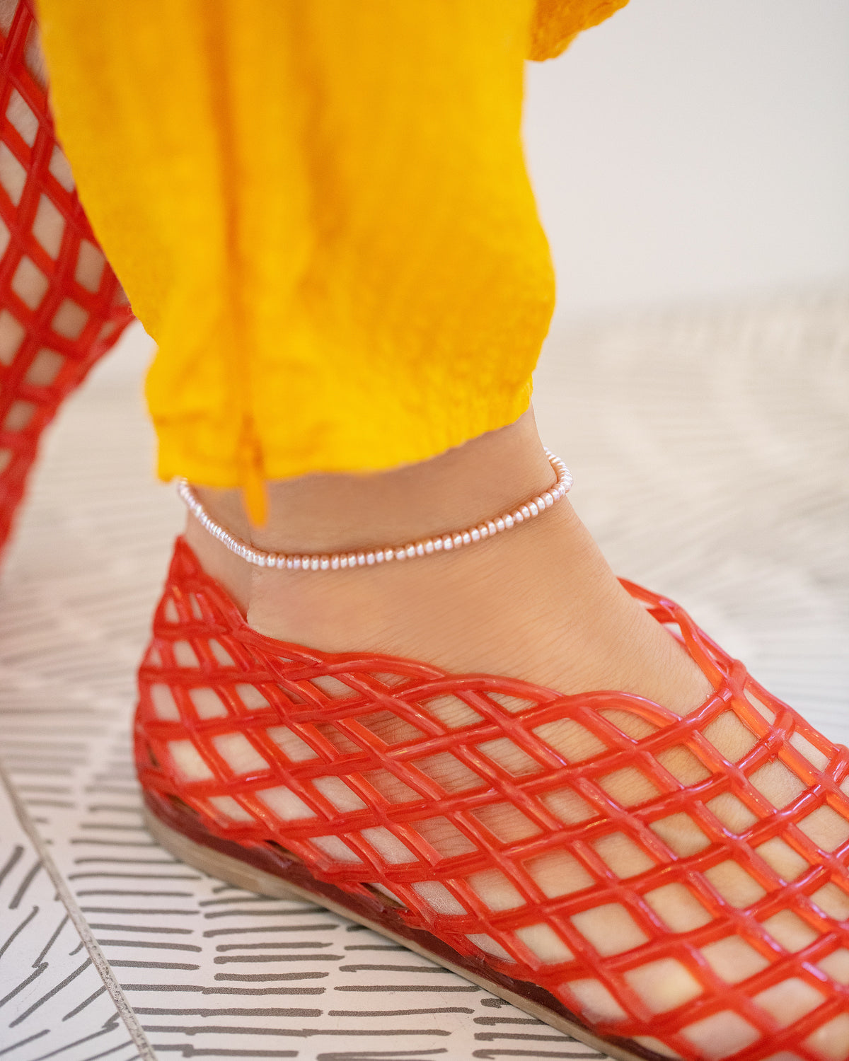 Pink Seed Pearl Anklet on model.