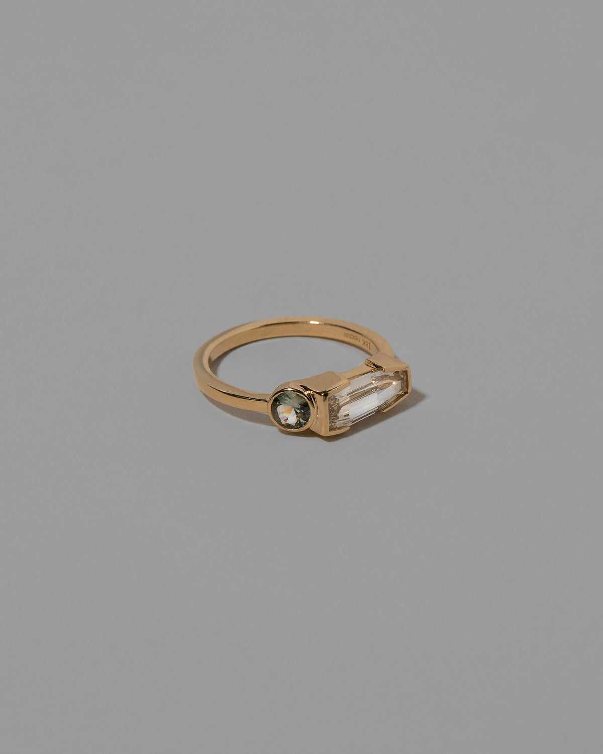 View from the side of the Cherish Ring on light color background.