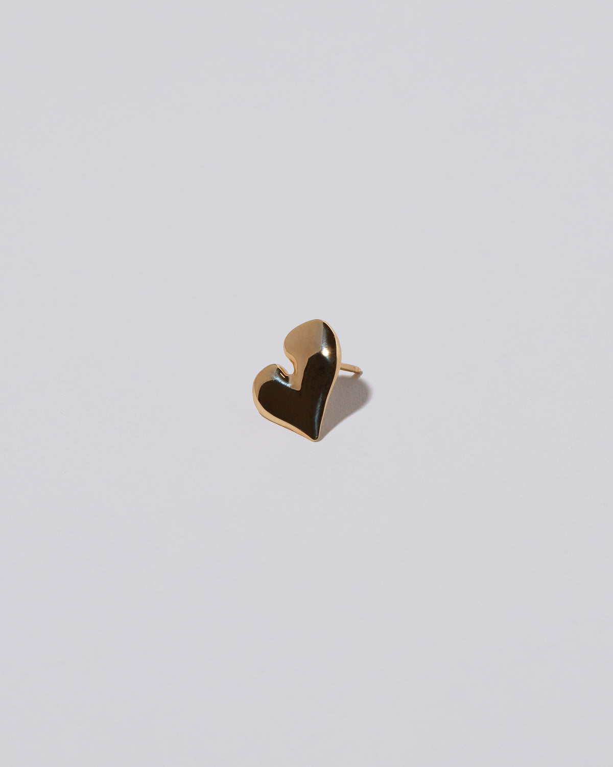 Thousand & One Night Heart Stud Earrings on light color background.