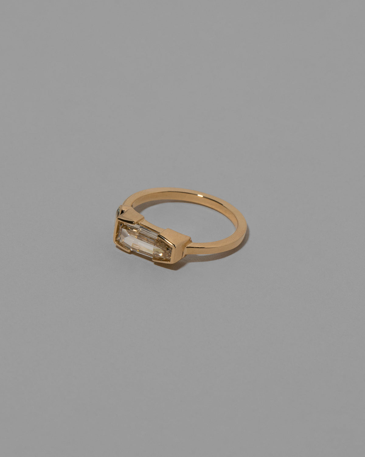 View from the side of the Cherish Ring on light color background.