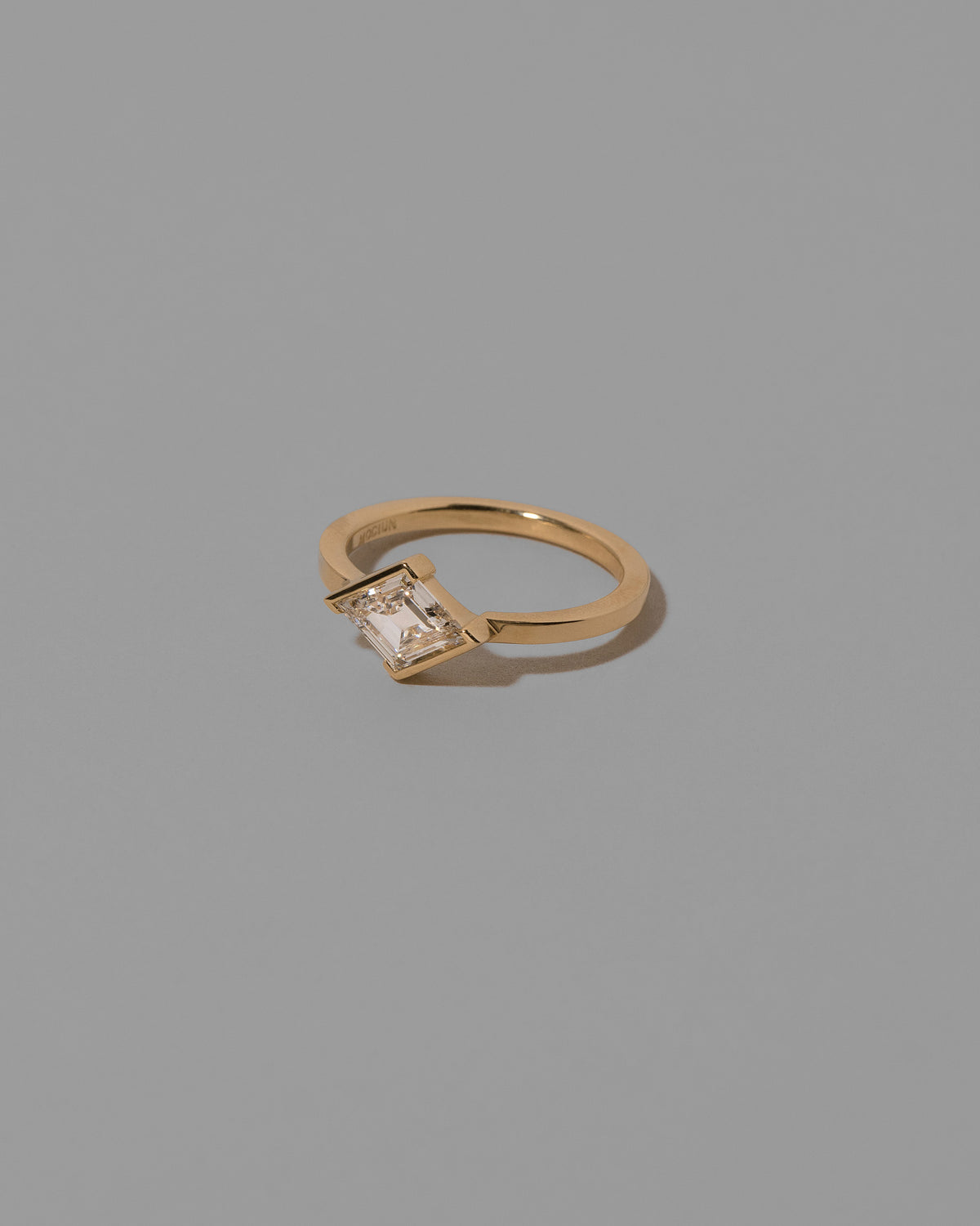 View from the side of the Benevolence Ring on light color background.