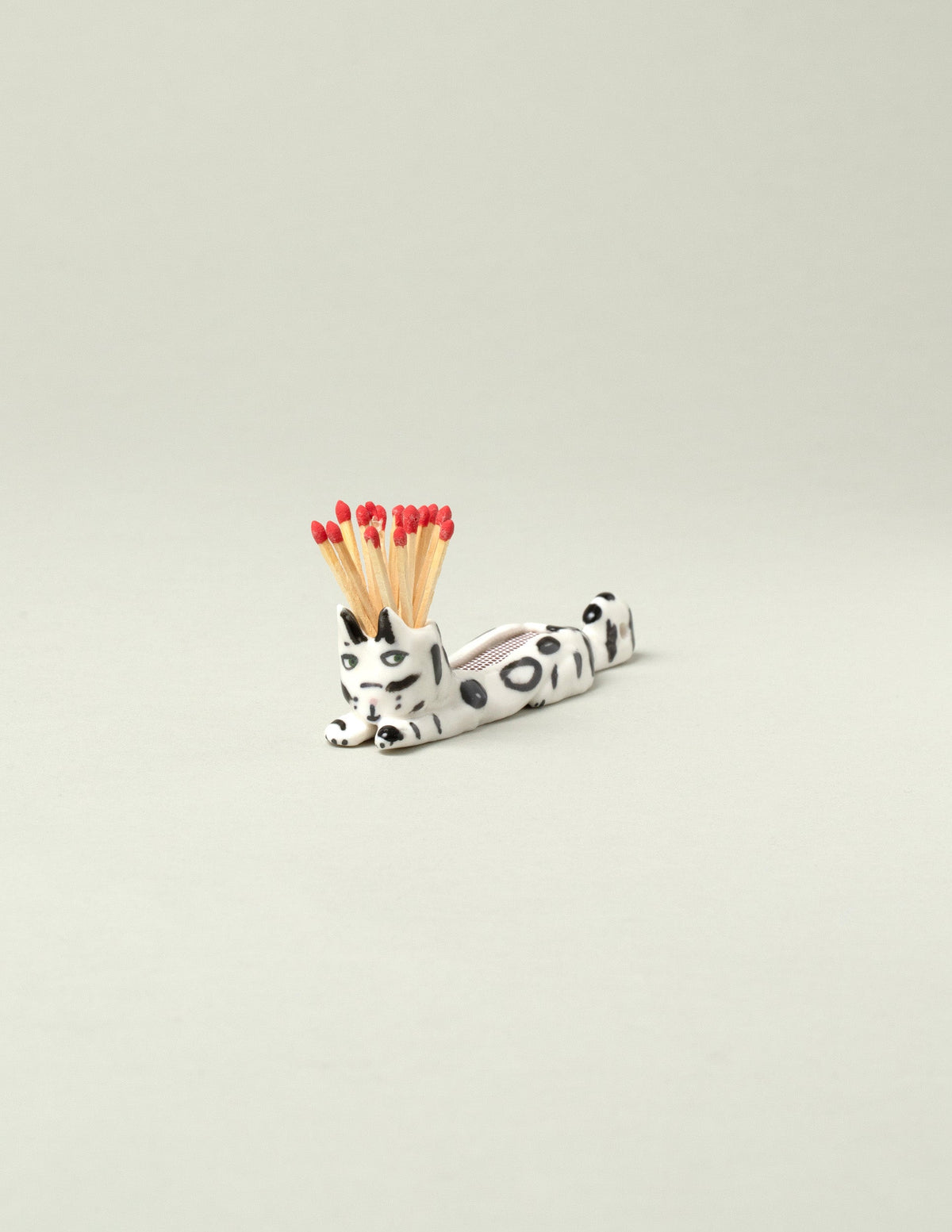 Eleonor Boström Black Spots Matchstick Cat on light color background.
