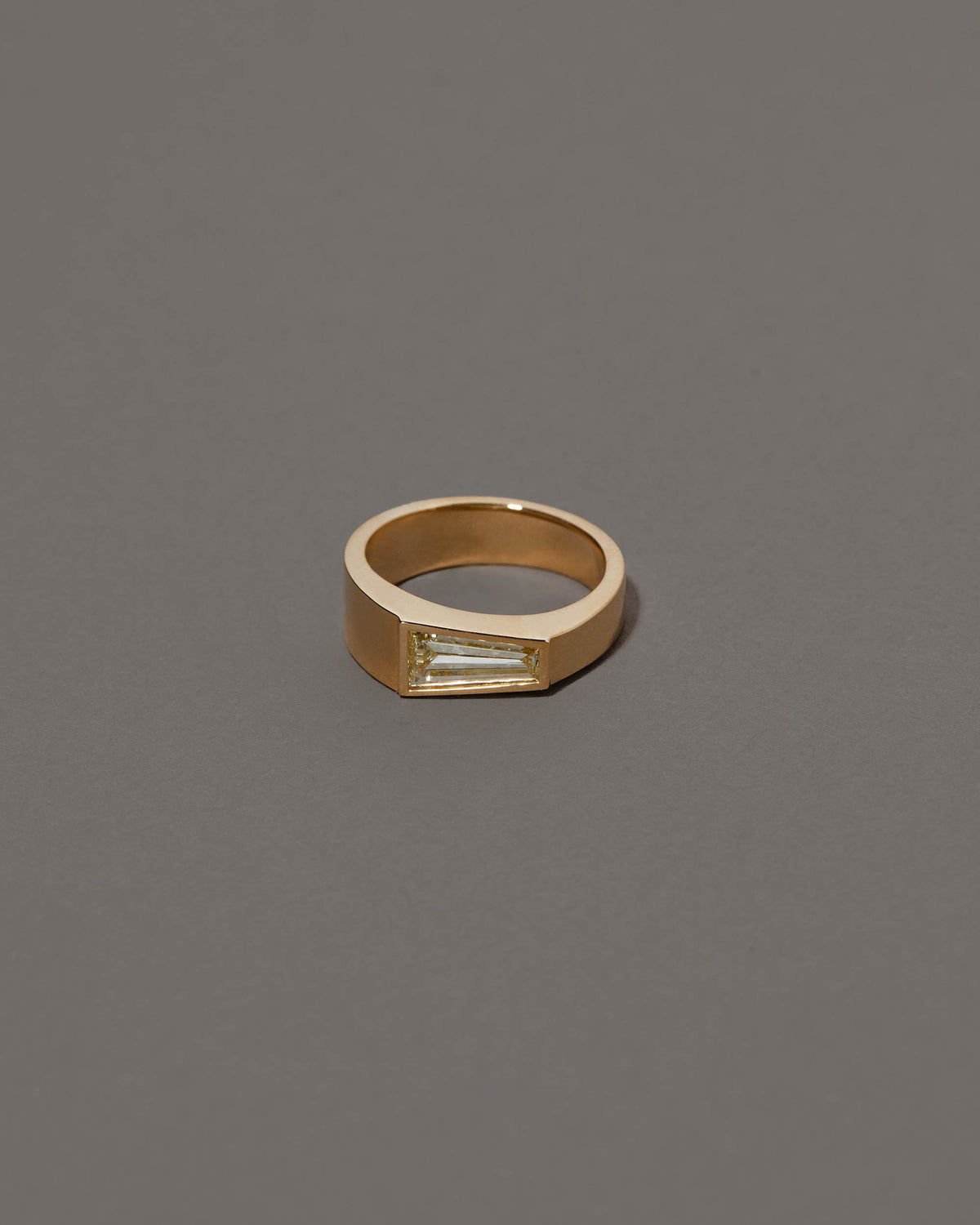 Joviality Ring on grey color background.