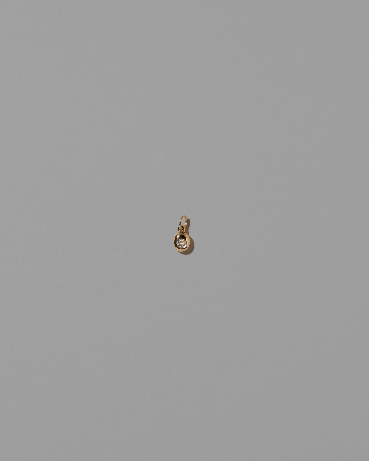 Diamond Birthstone Level Charm on light color background.