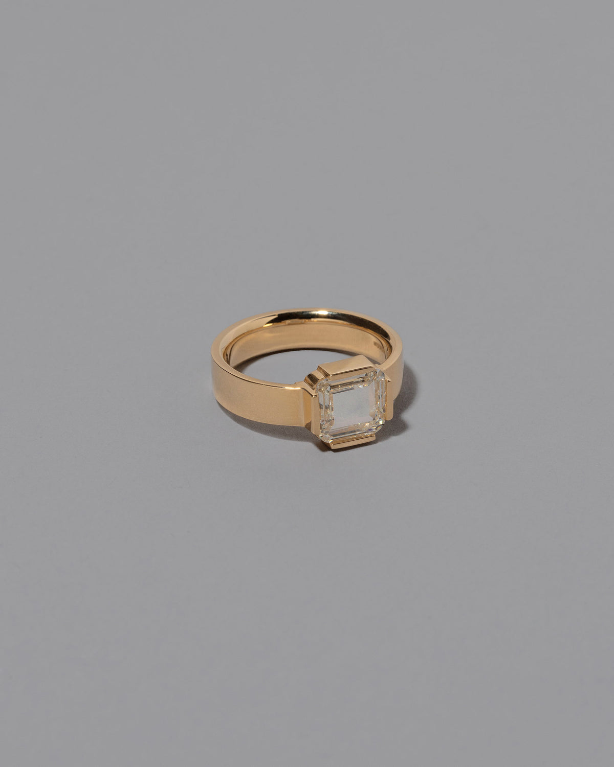 View from the side of the Flatten Ring on grey color background.