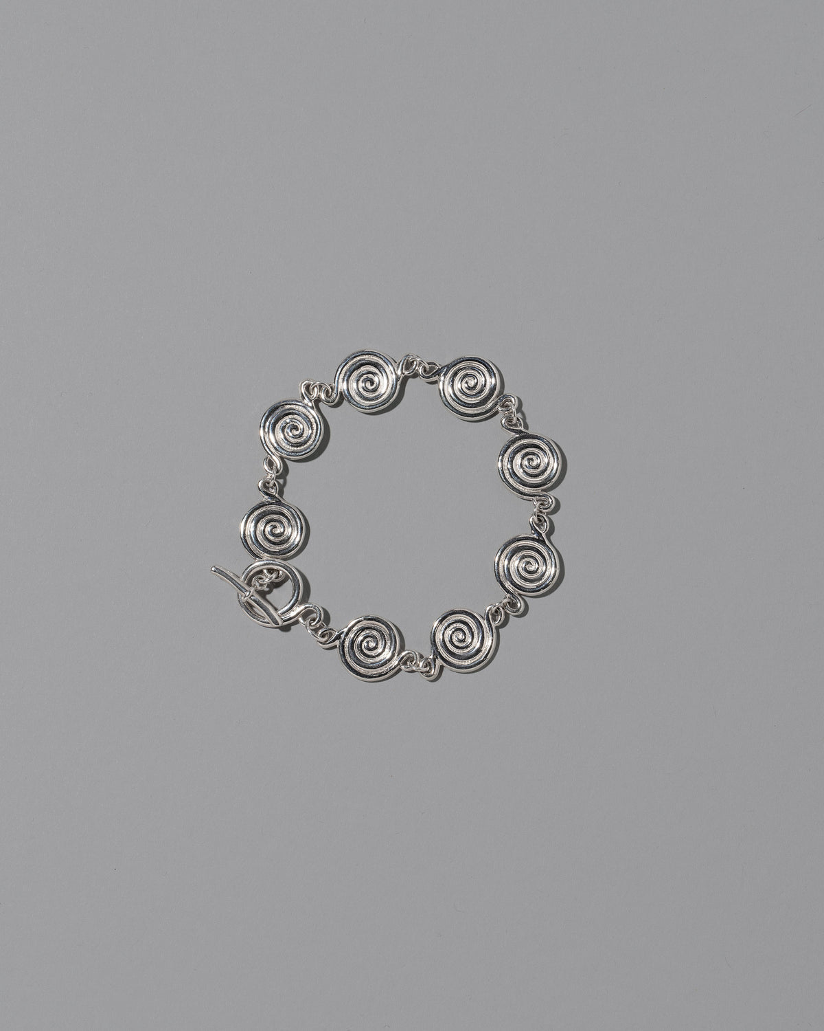 CRZM Sterling Silver Serpentinite Bracelet on light color background.