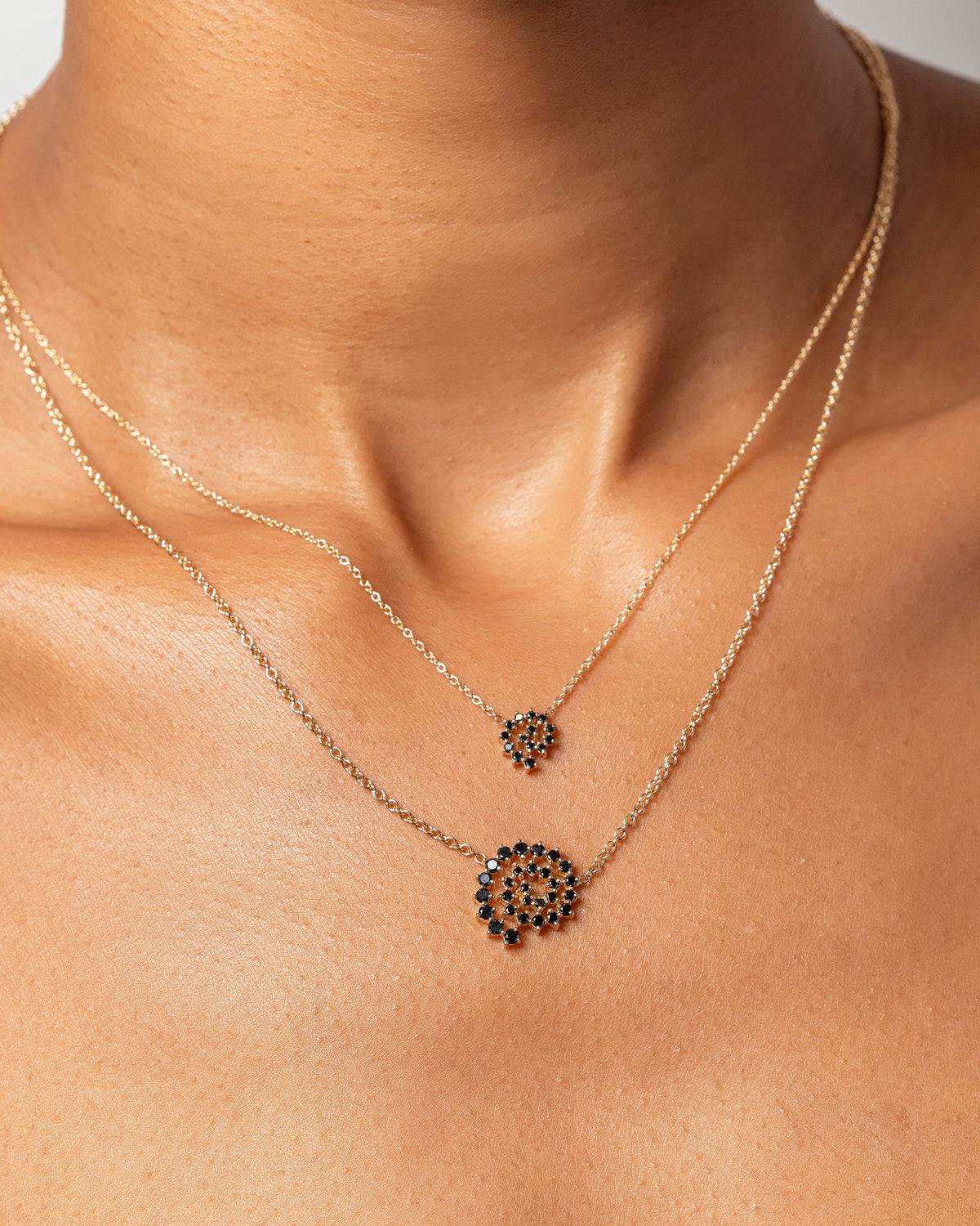 Mini and Full Black Diamond Spiral Necklaces on model.