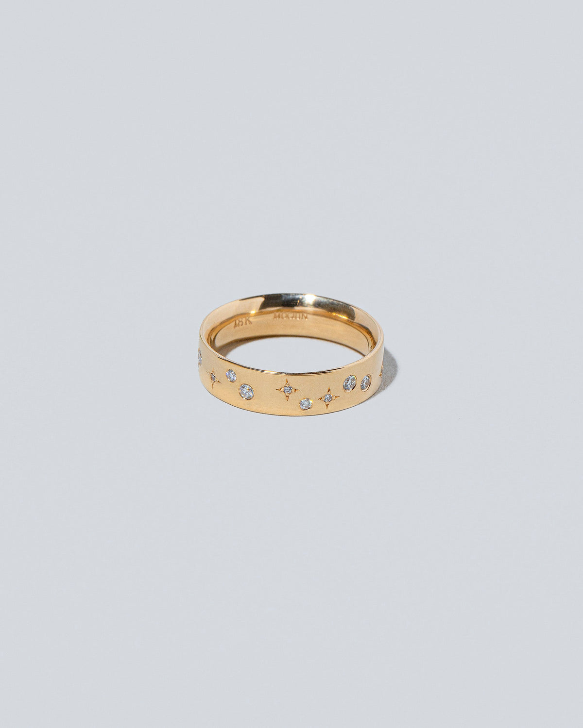 Closeup detail of the Gold 5mm Square Wire Band with Big Array White Diamonds added on light color background.