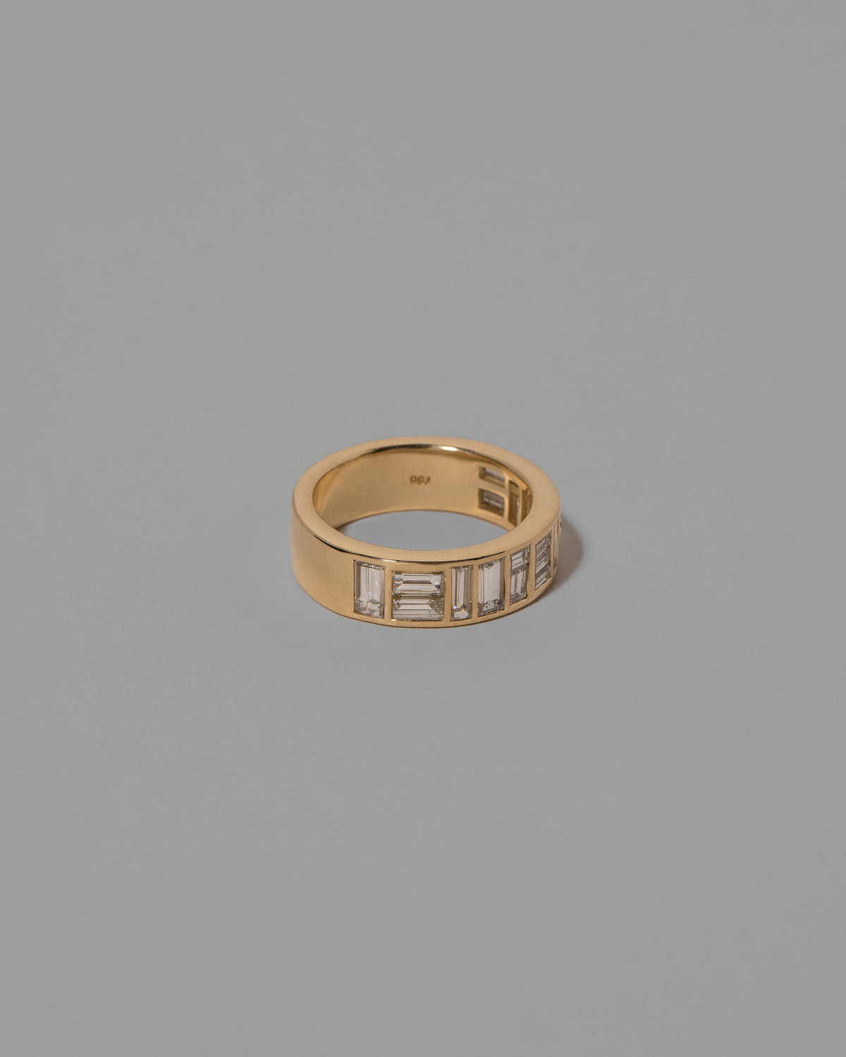 View from the side of the Mega Piet Ring on light color background.