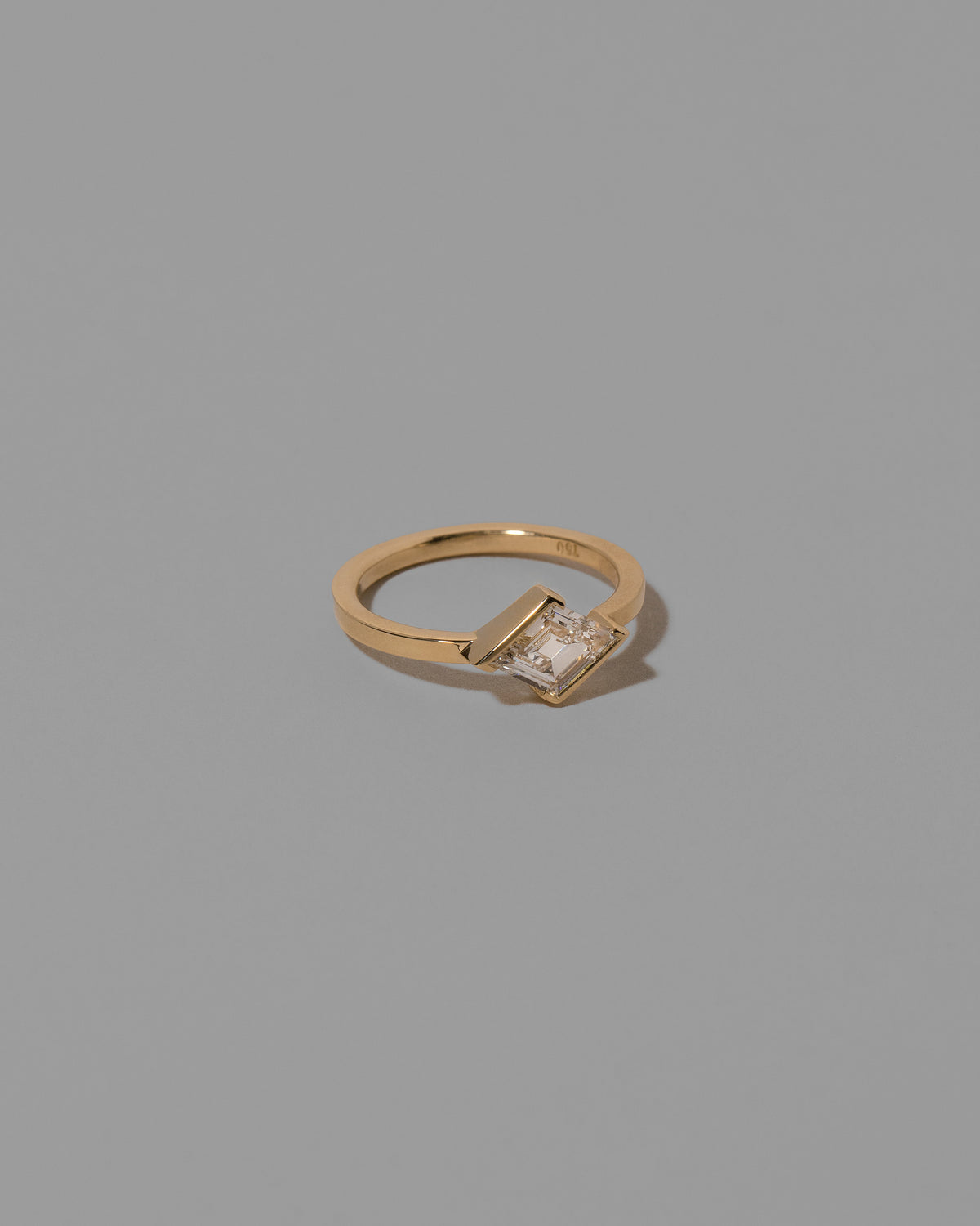 View from the side of the Benevolence Ring on light color background.