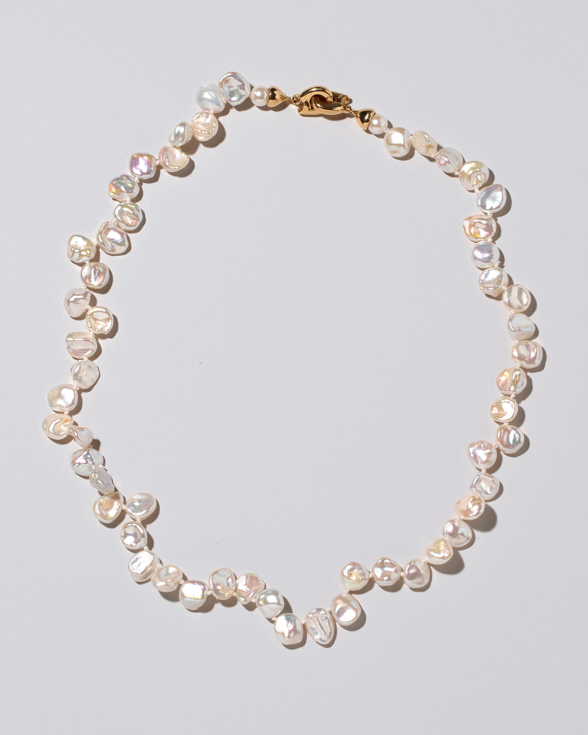 Tern Pearl Necklace on light color background.