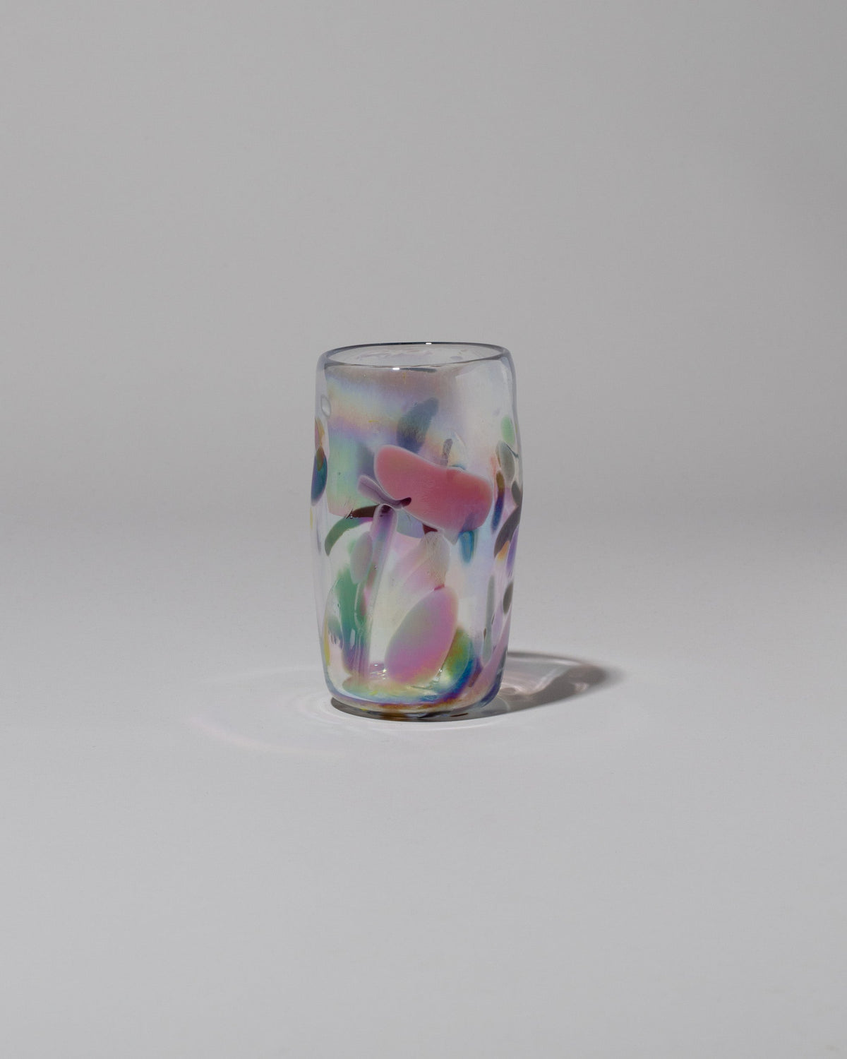 Sirius Glassworks Iridescent Nassau Tumbler on light color background.
