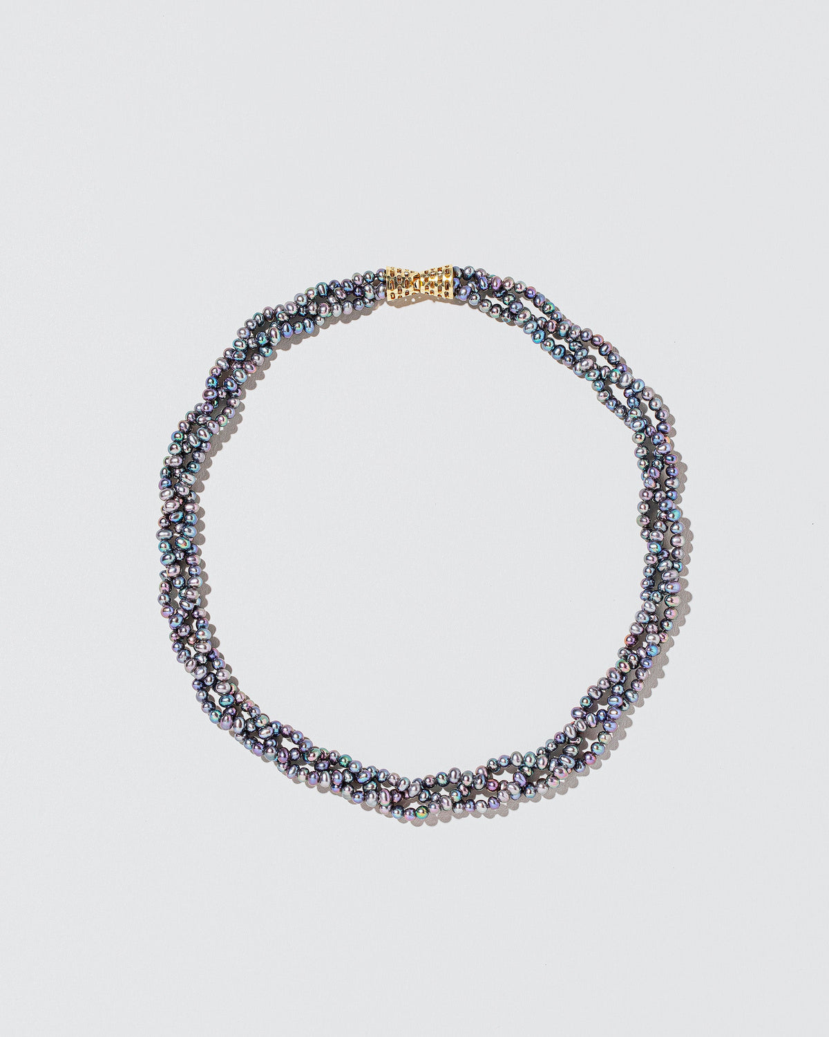  Braided Seed Pearl Choker on light color background.
