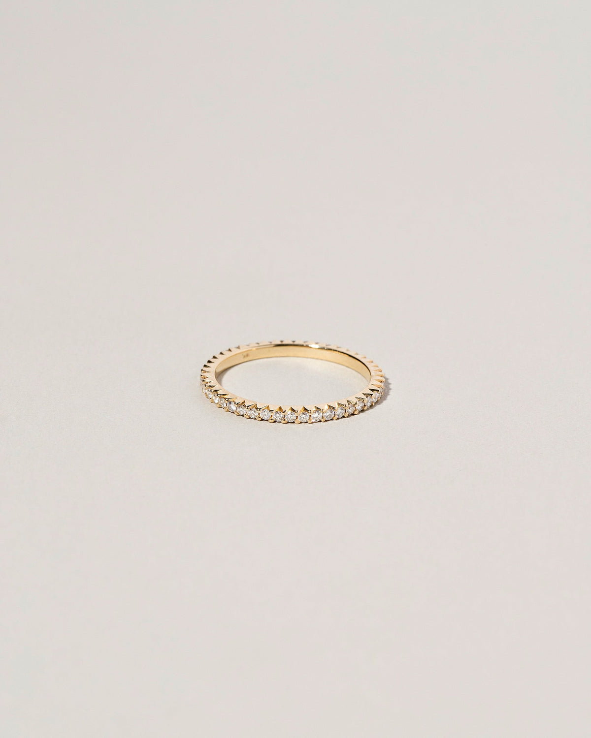 Gold White Diamond Gear Edge Band on light color background.