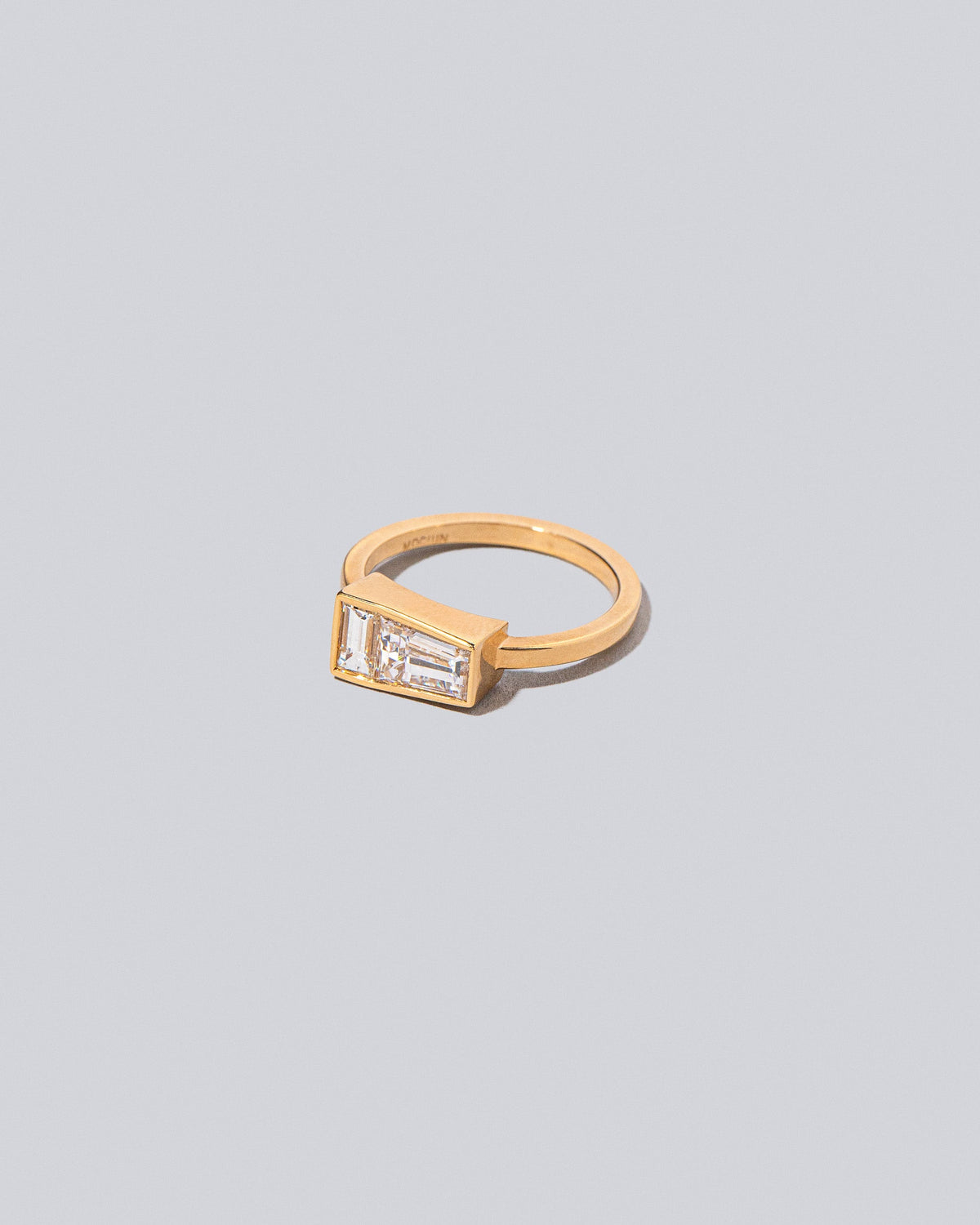 View from the side of the Ode Ring on light color background.